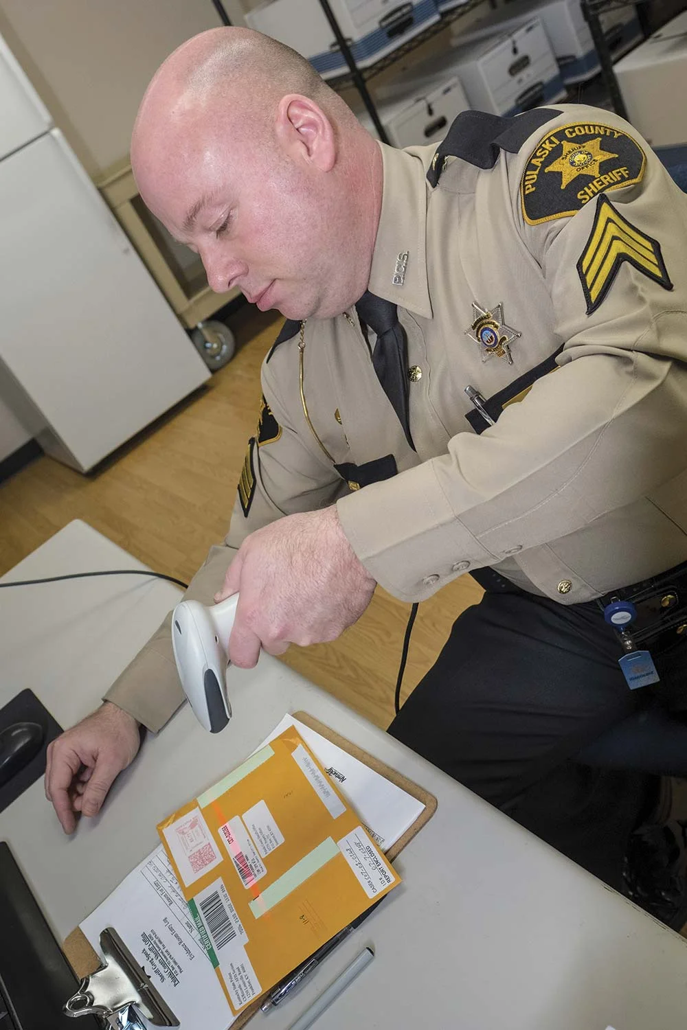 Pulaski County Sheriff’s Sgt. Glen Bland said a modern digital tracking program helps with property and evidence management and is much more reliable than a hand-written log. (Photo by Jim Robertson)