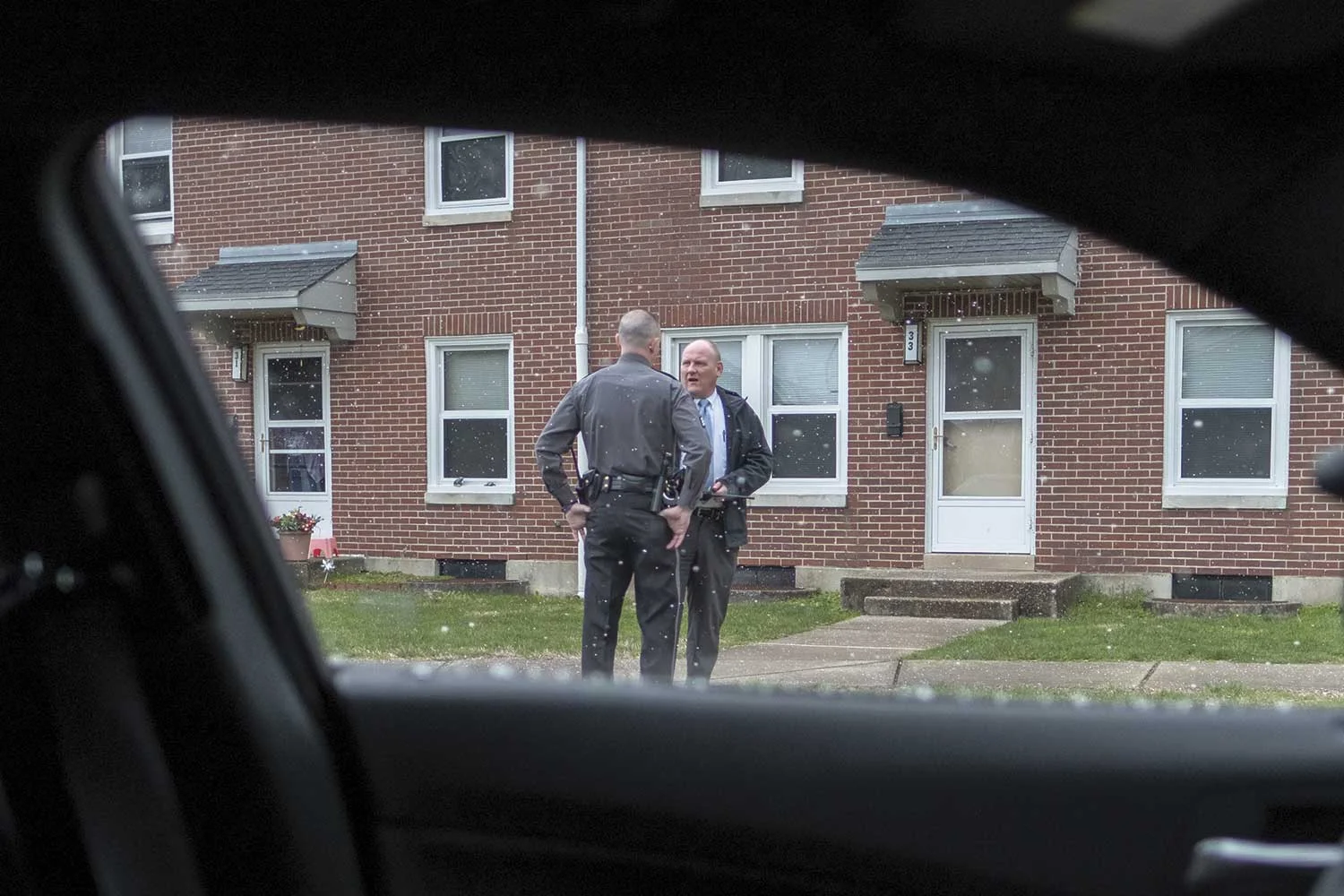 Maysville Police Sgt. Zach Sutton (left) talks with MPD Detective T.C. Rice during a call to a local residence. Sutton has spent 13 years with MPD and serves in multiple roles. Rice has been with MPD since 2001 and has been a detective for the past six years alongside Detective Chris Conley and another undercover detective. Rice and Conley both are Maysville natives, a relationship with the community they agreed has helped in their investigative duties. (Photo by Jim Robertson)