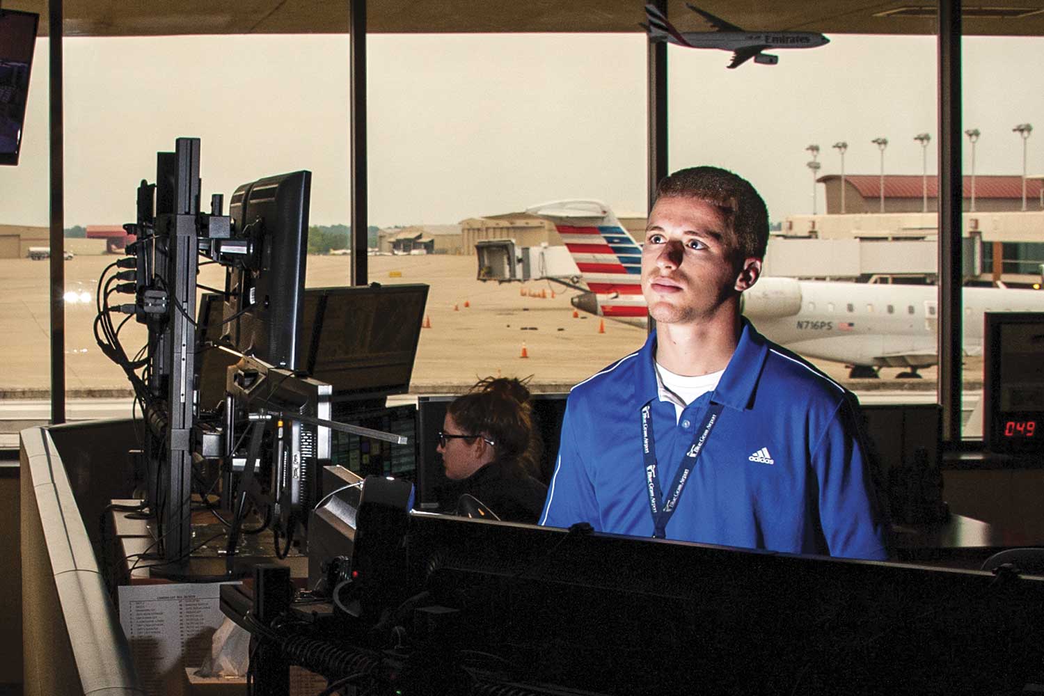  Operations Supervisor Christian Nelson, right, and Operations Specialist Sarah Ryan monitor for an assortment of calls. Operations is in charge of dispatching public safety officers as well as other aspects of airport functions such as maintenance 2