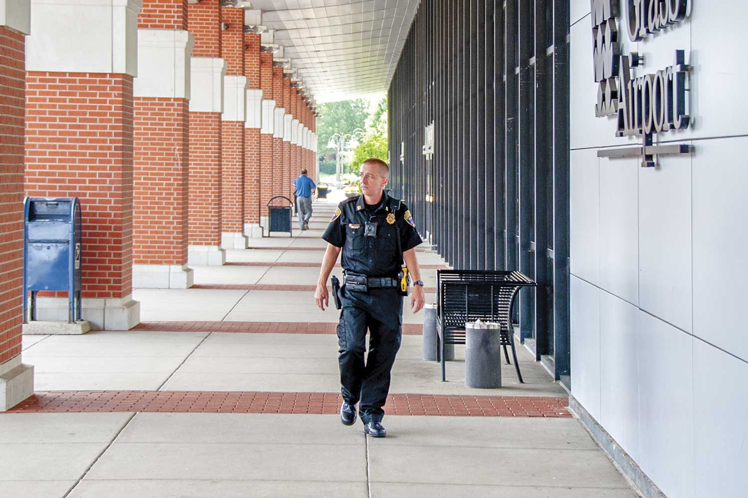  Blue Grass Airport Public Safety Capt. Keith Moore patrols outside the main terminal. (Photo by Jim Robertson) 