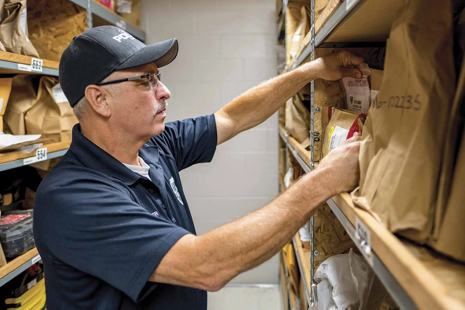Owensboro Police Reserve Officer Dane Holder is responsible for the department’s property and evidence maintenance. The agency recently completed renovations on a new 6,388 square foot building, adjacent to the police department, to expand its evidence maintenance facilities. (Photo by Jim Robertson)