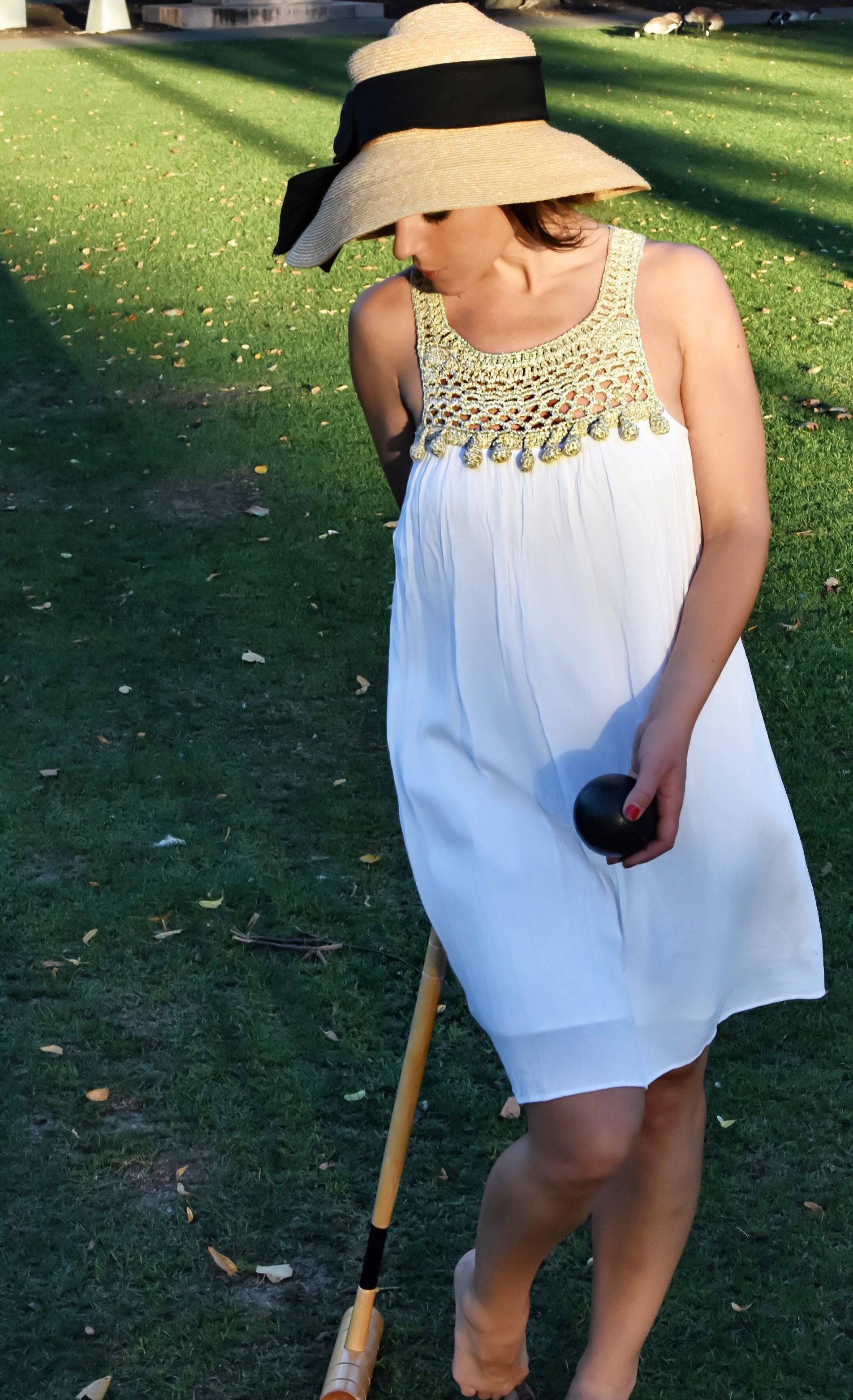 When selecting a croquet costume, it is wise to bear in mind that a proper croquet shot often requires one to bend at the waist and swing one's mallet through one's legs. This adorable Lilly frock offers both coverage and mobility.