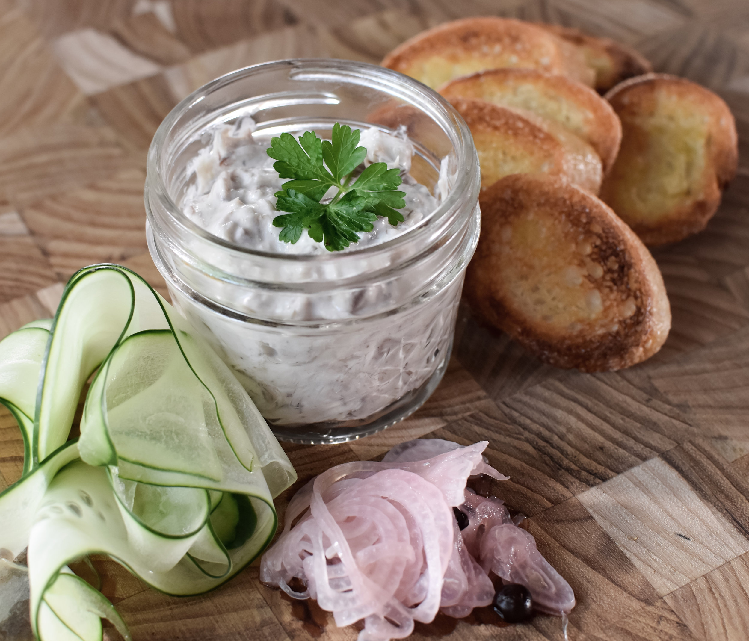 Crisp cucumber, house-pickled shallots and warm toasted baguette prove ideal accompaniments to smoked bluefish pâté.