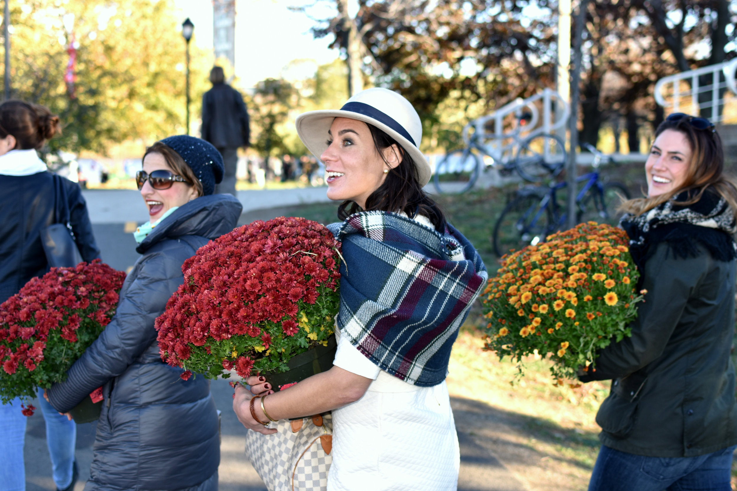 Colorful mums which decorated the Reunion Village found new homes following the close of ceremonies.