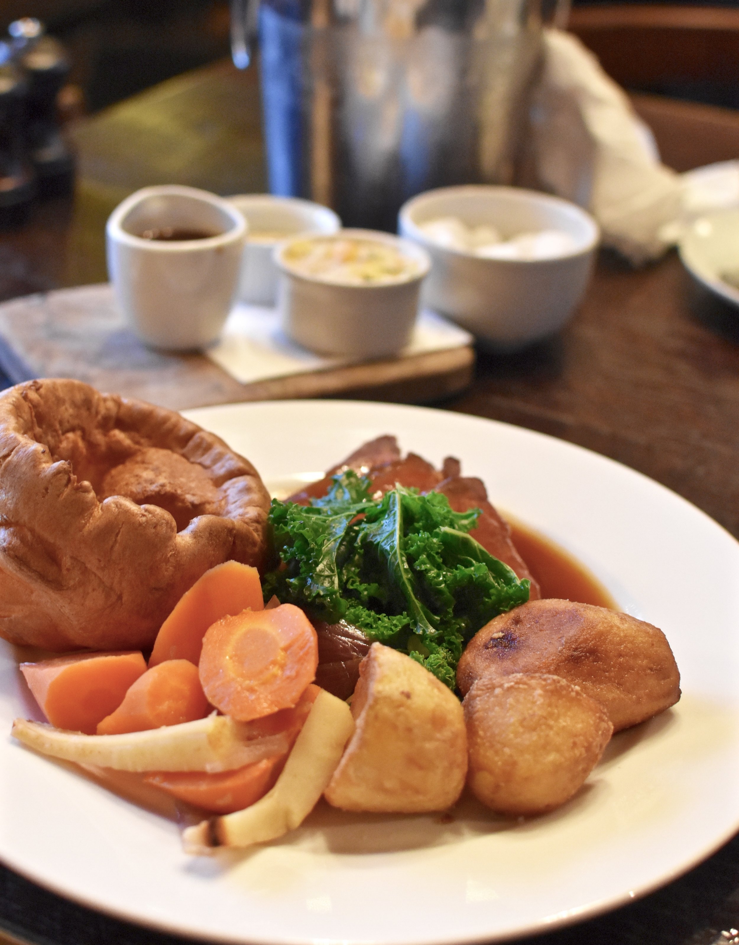 Roast rump of Cumbrian beef served with creamed horseradish, Yorkshire pudding, gravy, duck fat roast potatoes, cauliflower cheese, roasted roots and greens at The Gun.