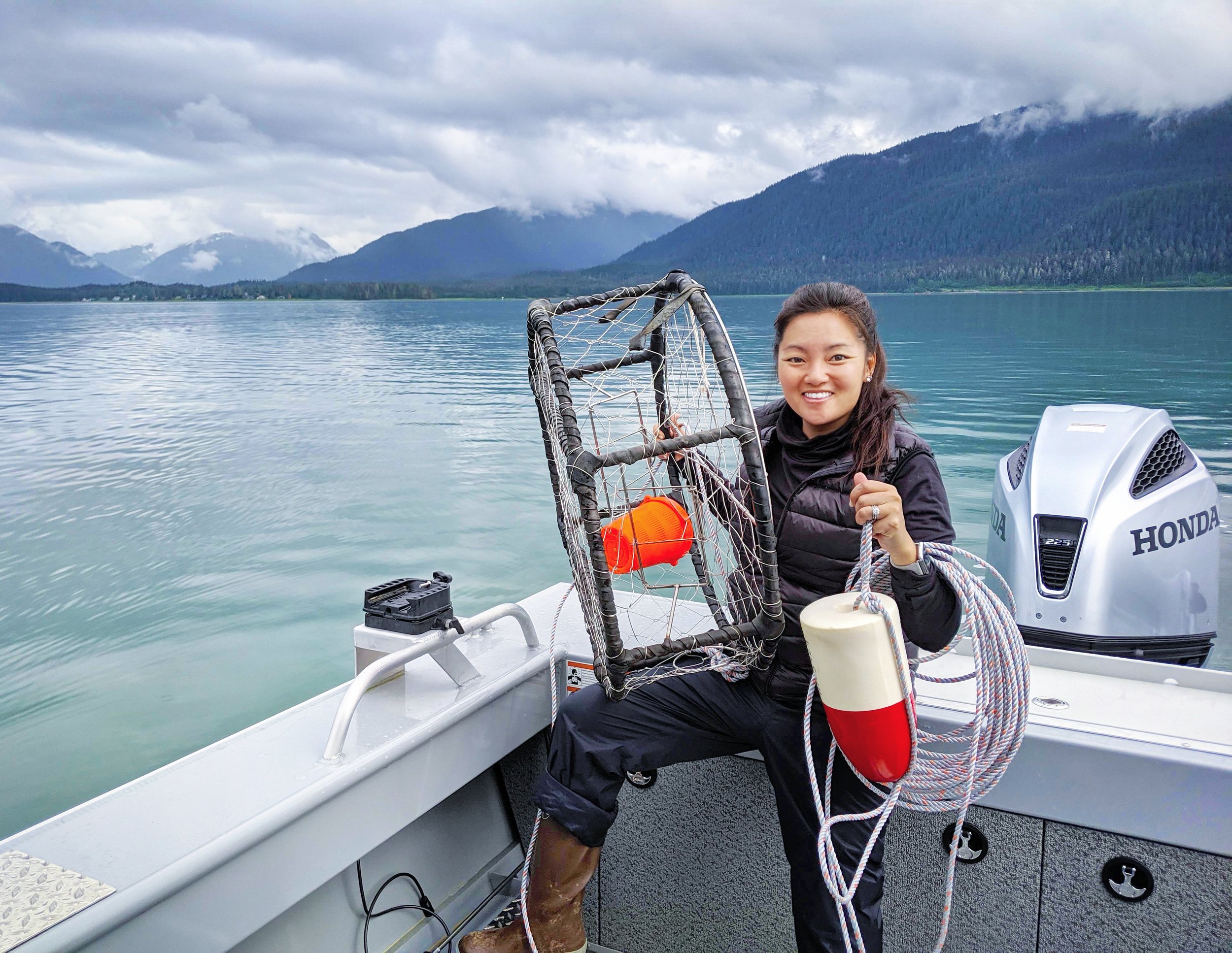 woman with crab pot in Juneau alaska