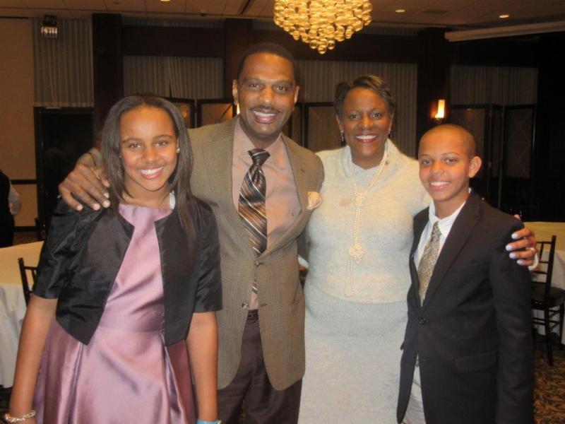My arms are around two of my deepest loves--my husband and my son. 