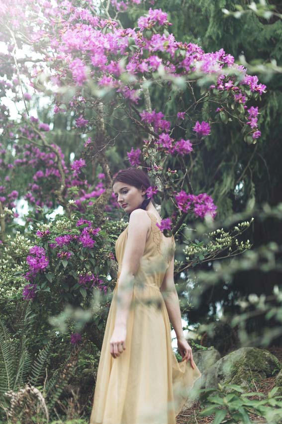 Pacific Northwest art photography model in forest with rhododendrons and antique dress