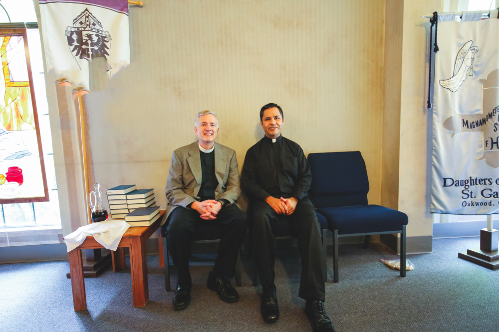ABOVE: The Rev. Peter Wallace and Fr. Samuel Porras work together to build community
