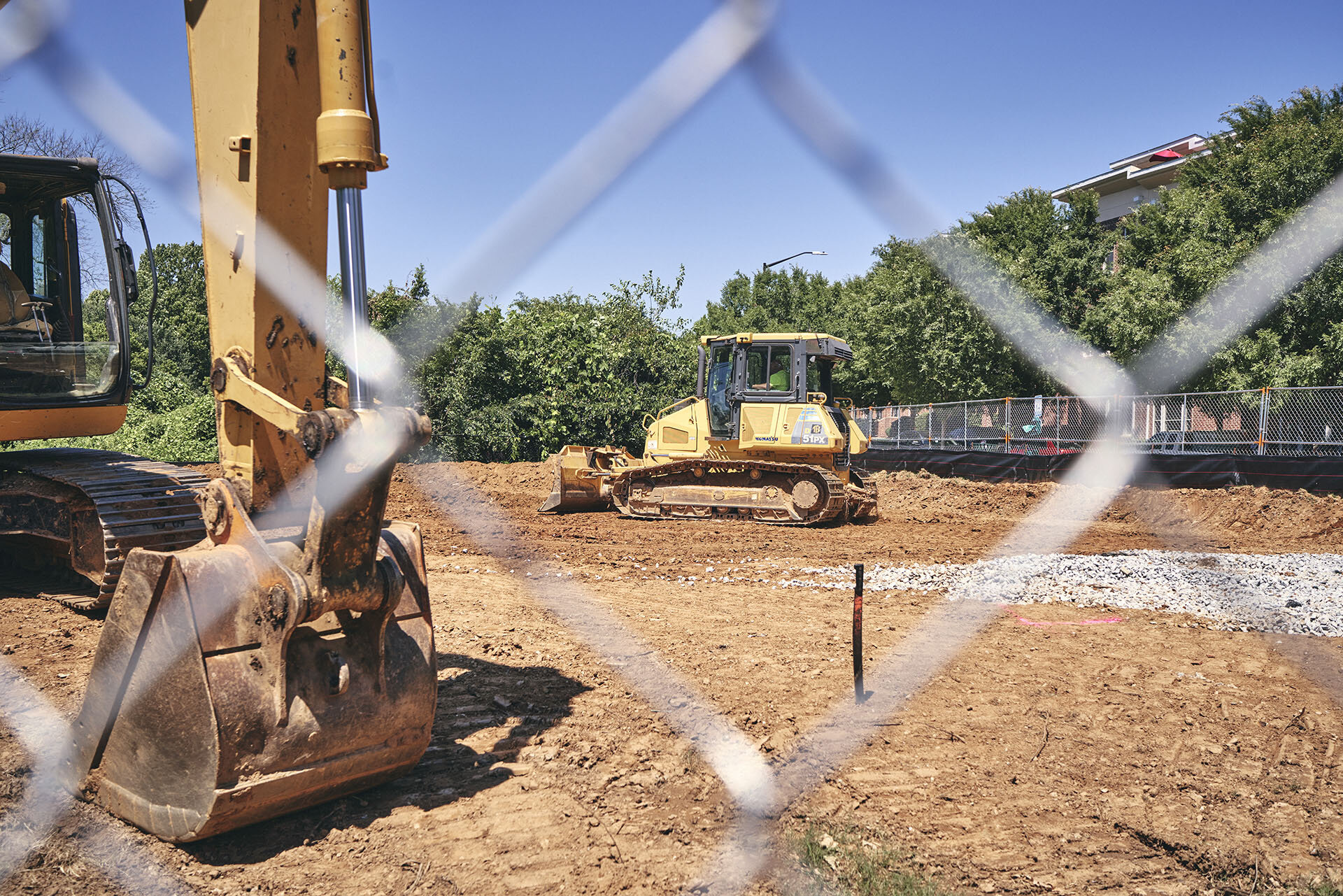 The big dig: heavy equipment makes space for the bridge that will blend into the landscape where the north and south forks of Peachtree Creek join.