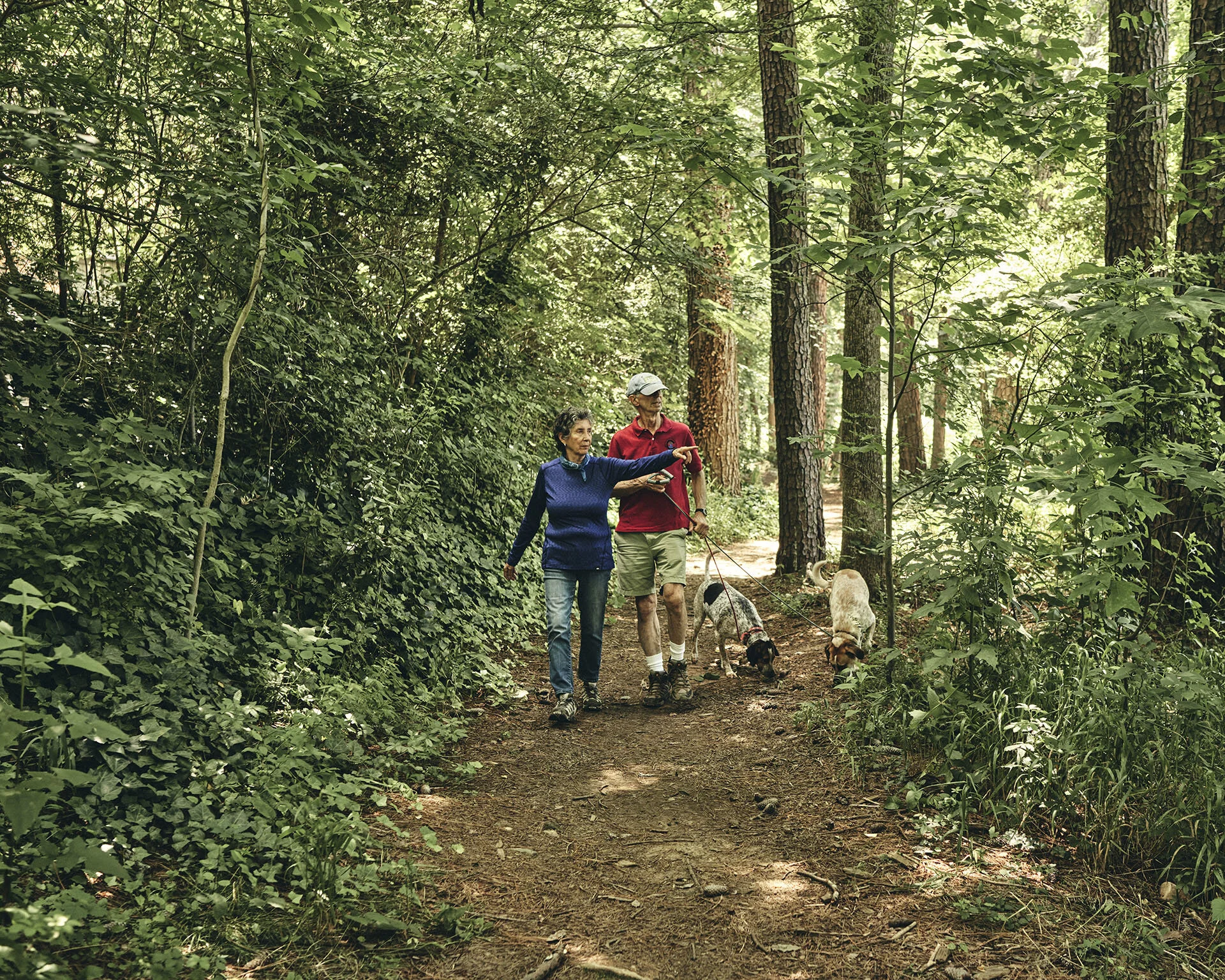 Richard and Dorothy Sussman and their “granddogs,” Luna and Ruby, on a morning trail walk.