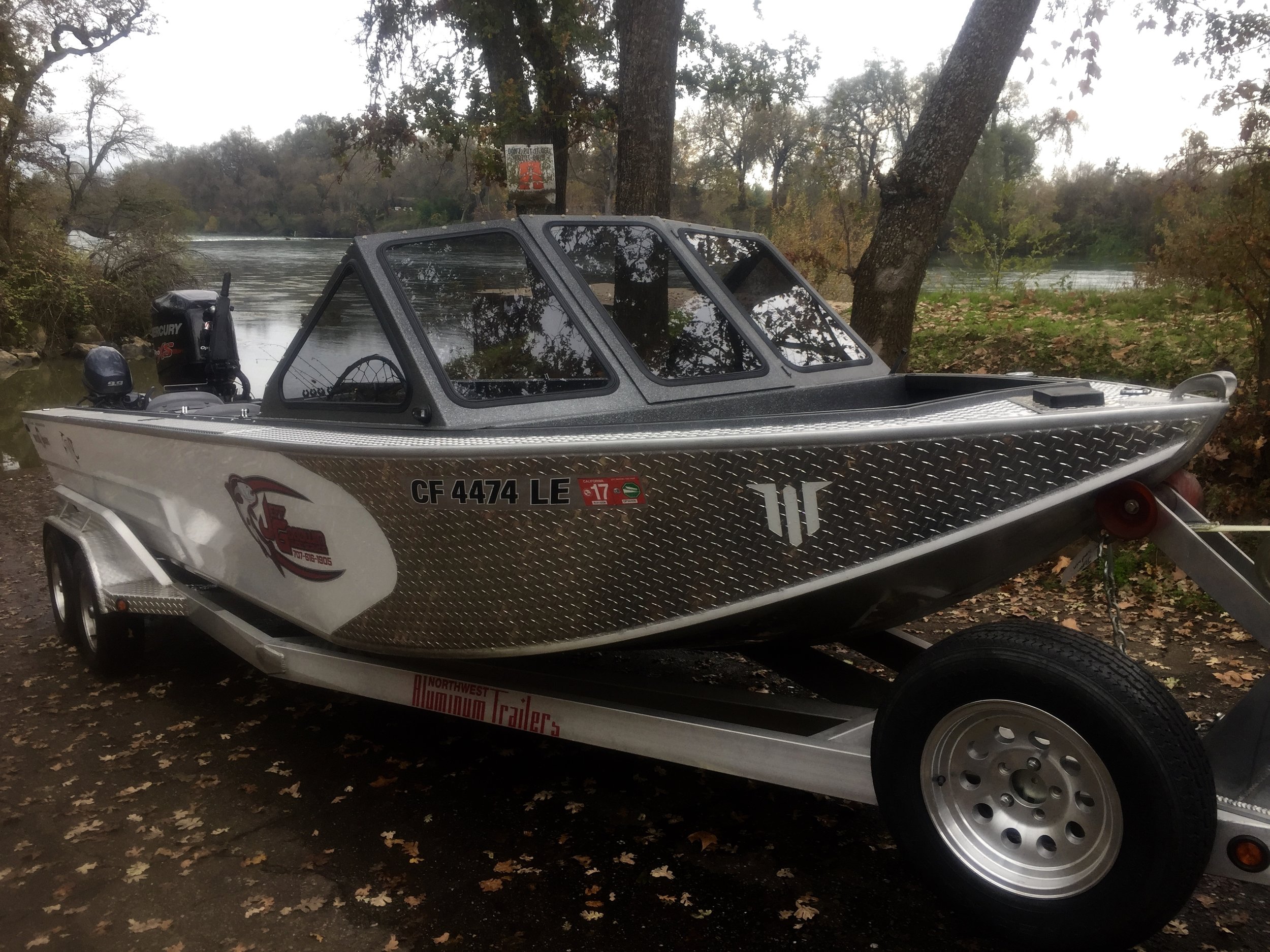 Our 2014 Willie Fuzion jet boat pictured with a new removable windshield.
