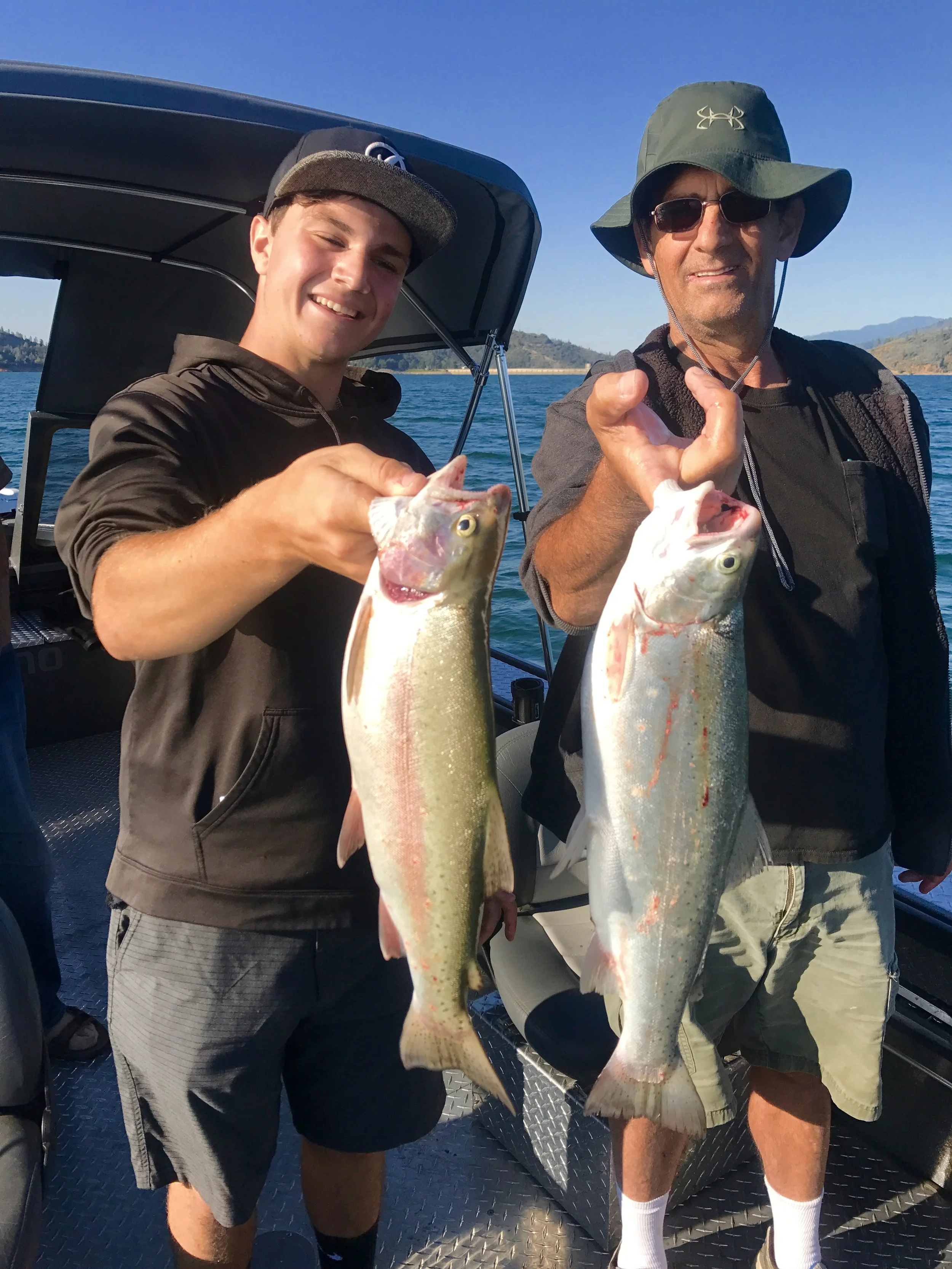 Father and son showing off their great Shasta Lake rainbows!