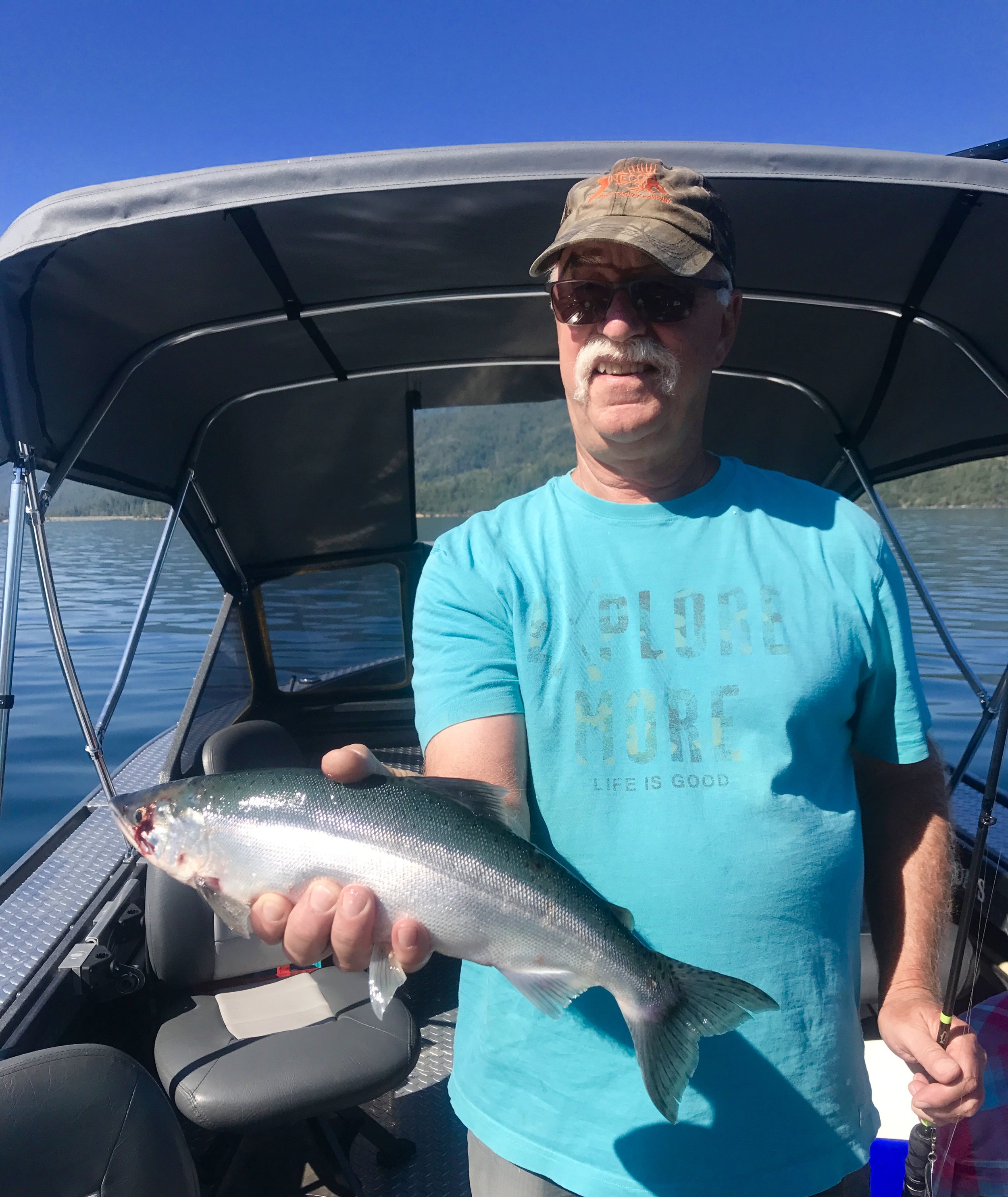 Happy client who's learned the ins and outs of catching Kokanee salmon on Whiskeytown Lake with me!