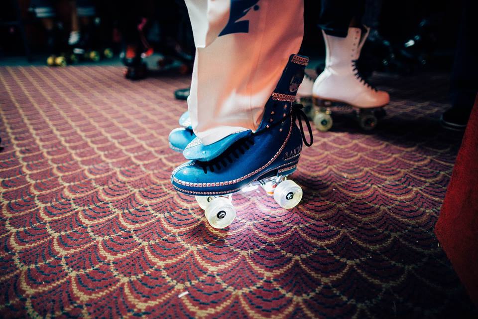   A skater shows off his Intricately designed skates - a typical down South style.&nbsp;  