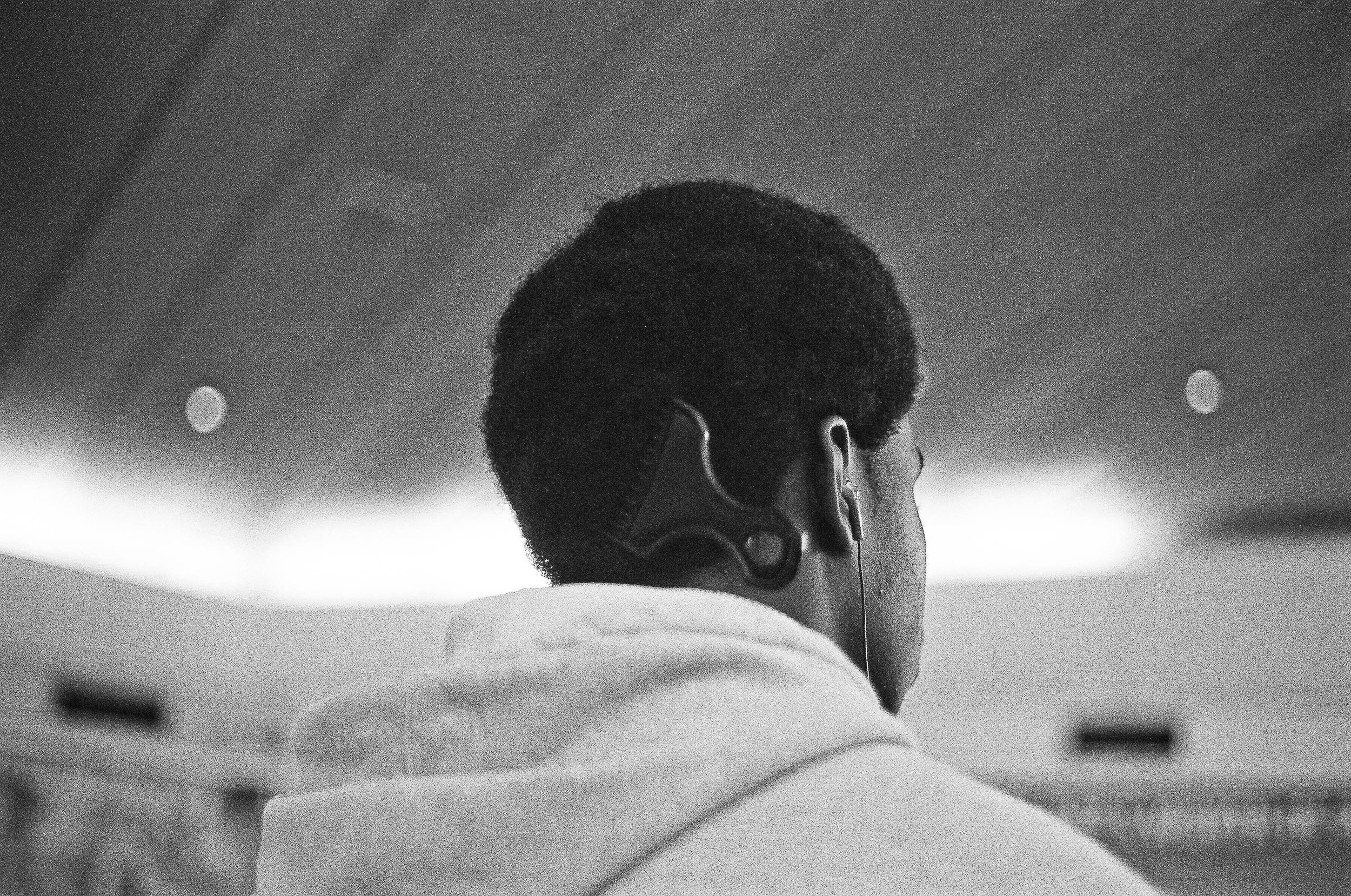   A young man waits for the doors to open at the Staten Island Ferry terminal in Manhattan  