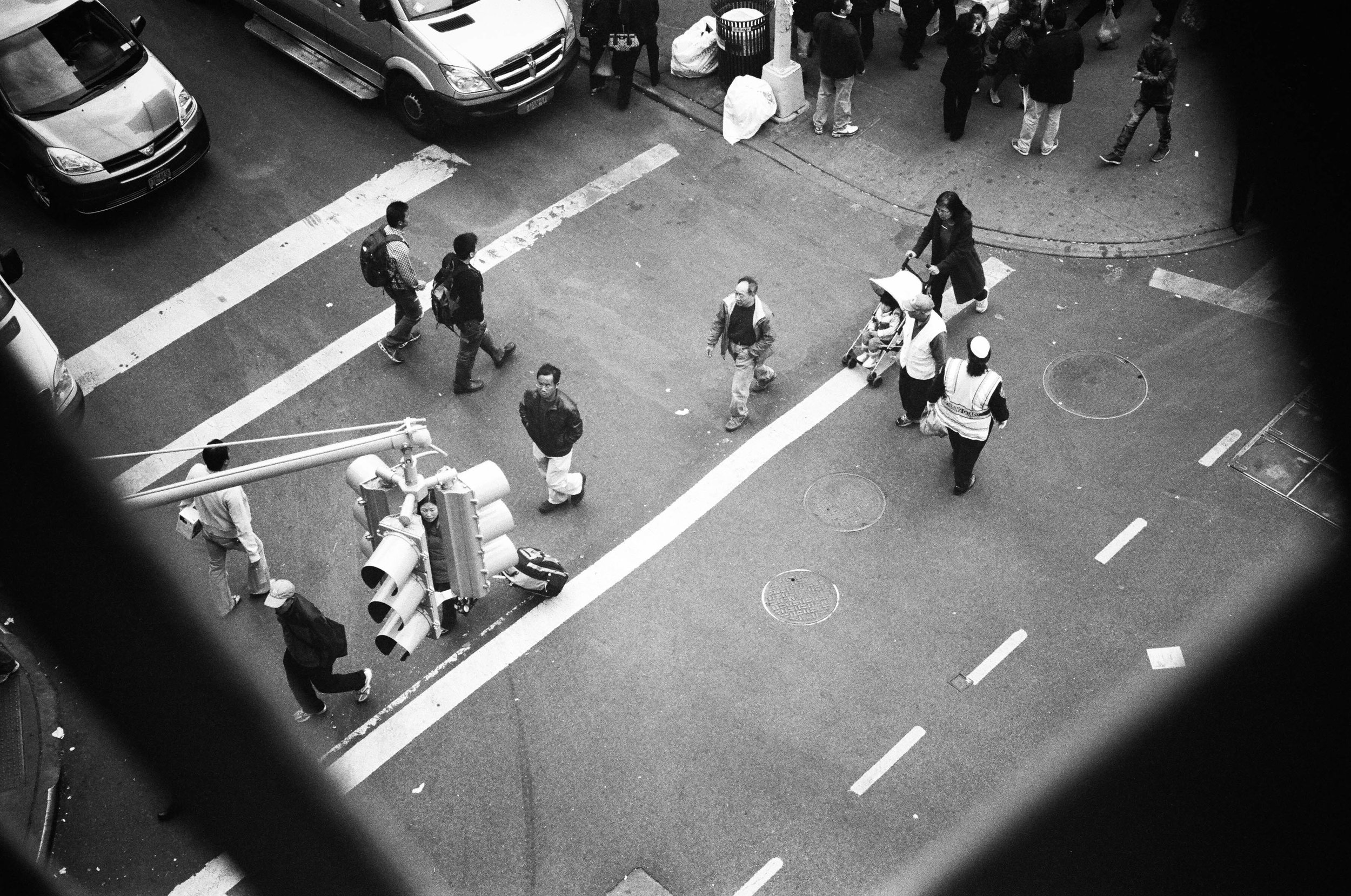   Pedestrians cross Division Street in Chinatown.  