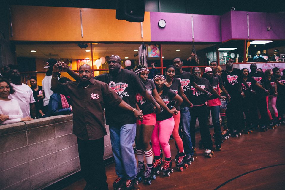 A "survivor train" at the 8th Annual Rolling for a Cause skate party which raises awareness and funds for cancer. All skaters are encouraged to join this train, which is an event tradition. Branch Brook Park Roller Skating Center. Newark, New Jersey. 
