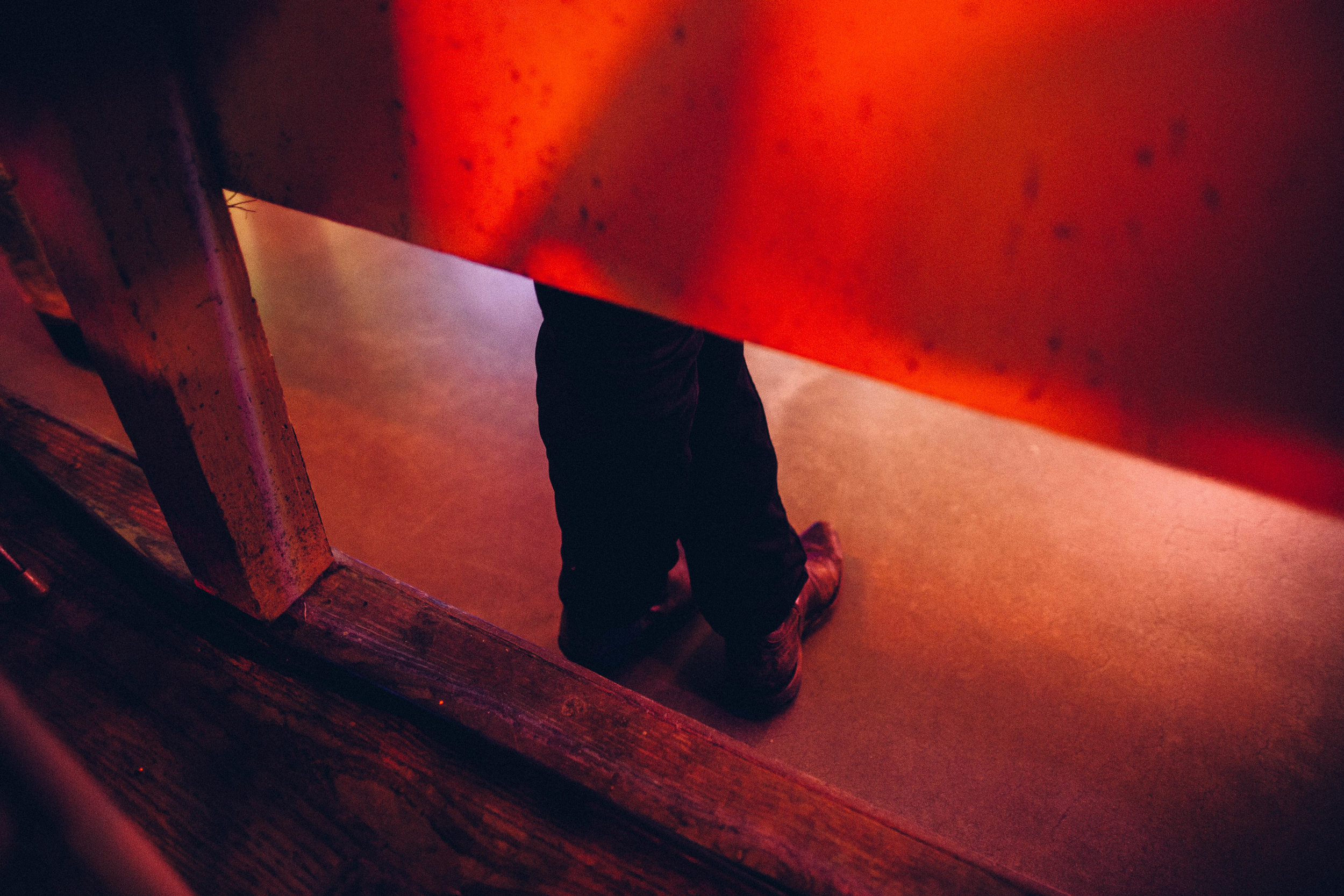 A man hesitates to join in on a line dance at Broken Spoke Dance Hall. Austin, Texas. 