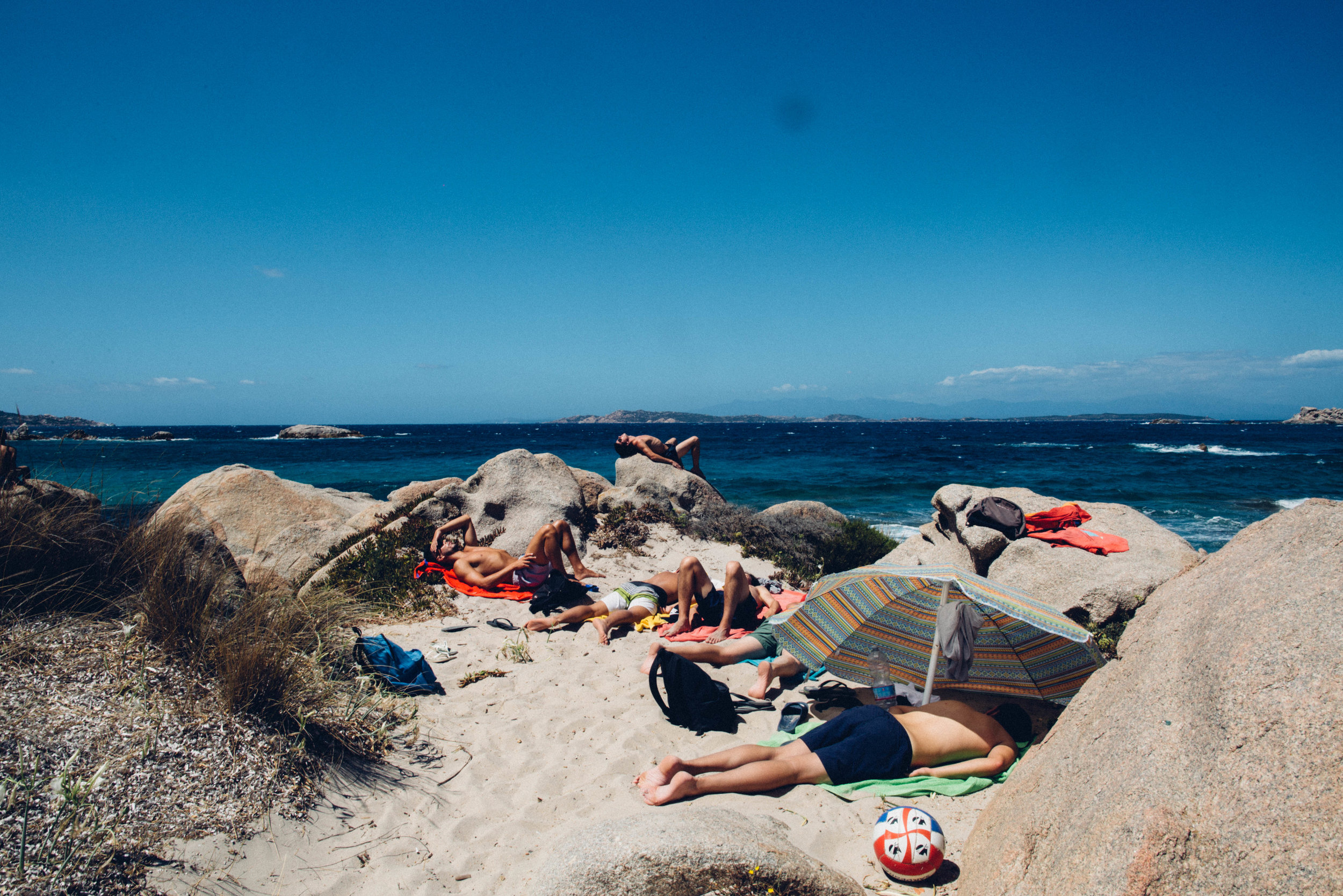   Beachgoers nap at Spiaggia Bassa Trinita in La Maddalena, Sardinia.&nbsp;  