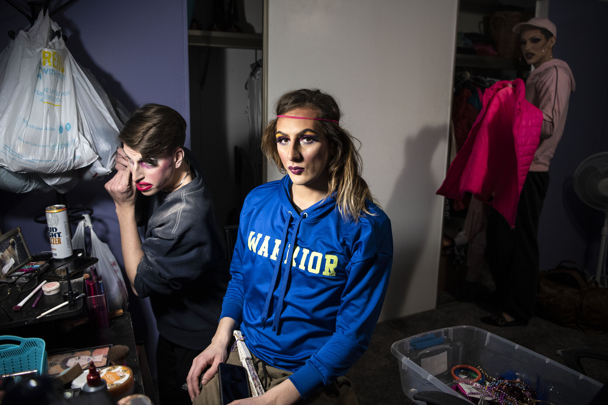  Members of the Good Vibe Tribe – Matt Bozzo, Sasha Banks, and Kristjon Jóhannesson – prepare for a drag show at the Music Factory in Battle Creek, Michigan on Sunday, Feb. 9. After the closure of Battle Creek’s popular gay bar, Partners, the Good Vi