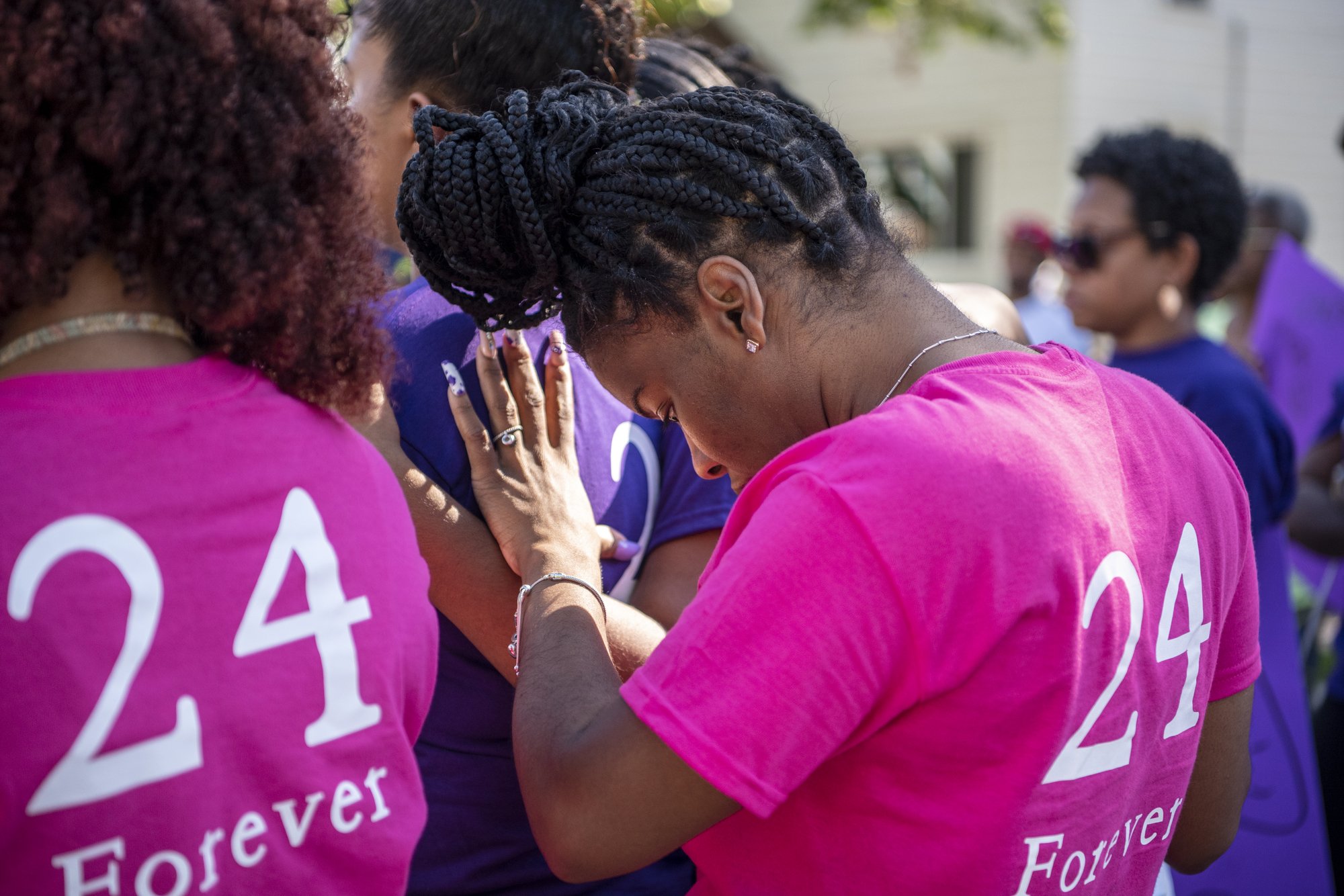  Ciera Caldwell leans on Kiara Richardson for support during a march for her 24-year-old cousin Eniyah Hollins in Battle Creek, Michigan on Thursday, July 1. Hollins was shot and killed at a house party on Hanover Street early Sunday morning, her fam