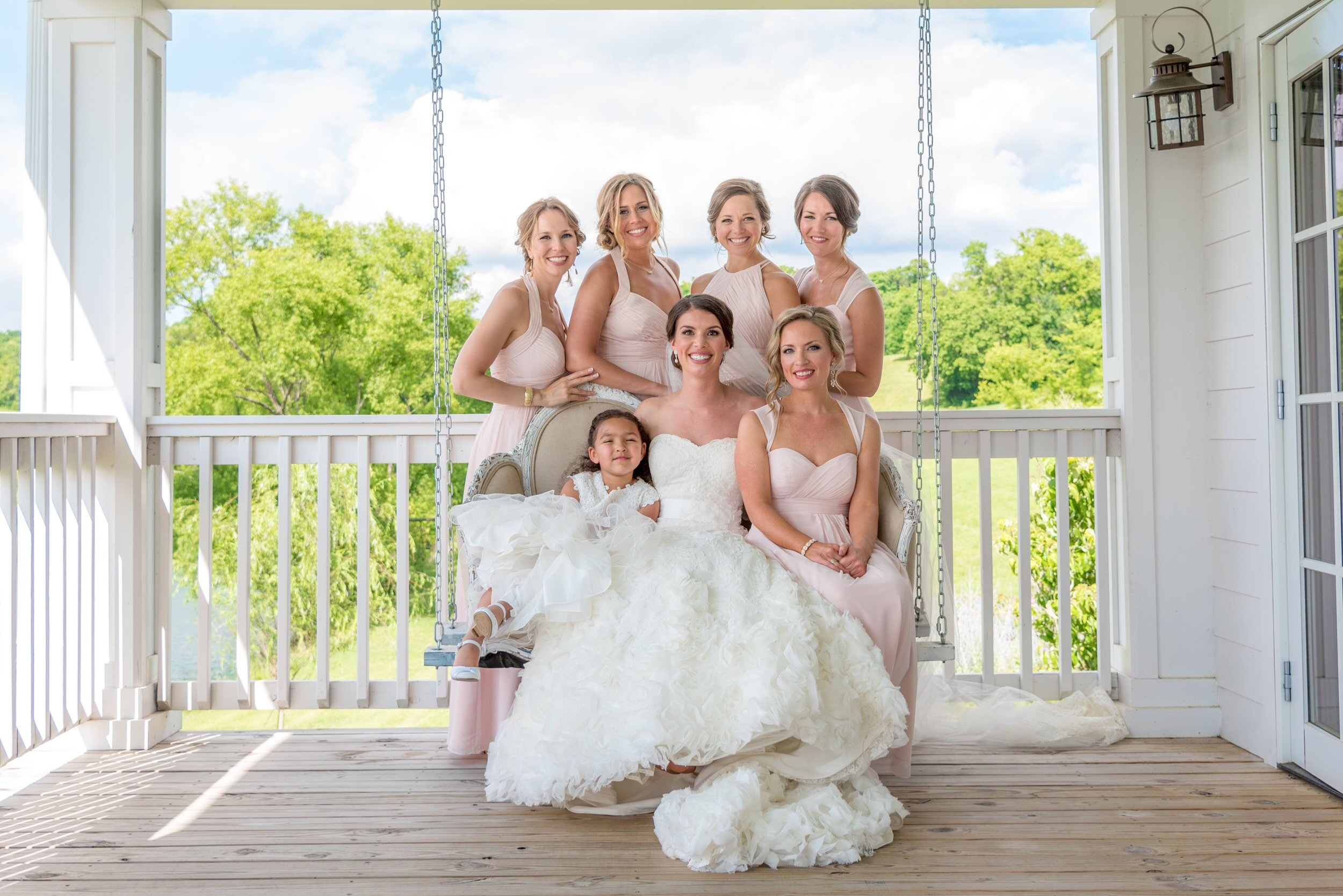 bridal-party-swing-wedding-dress-porch-chadandbriephotography.jpg