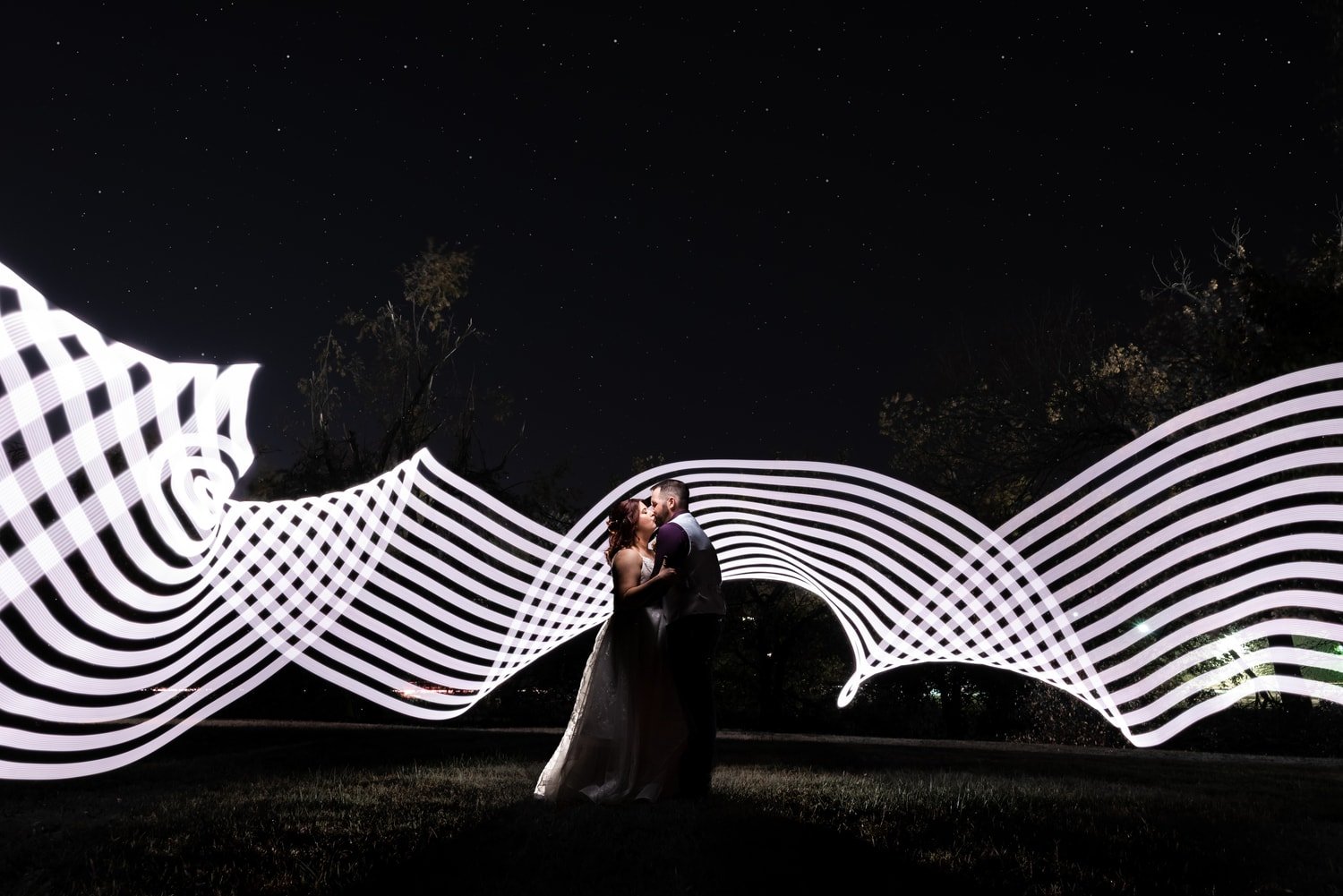 wedding-photographer-photography-okc-edmond-oklahoma-city-beautiful-bride-groom-night-portrait-light-saber-light-wand-fun-chadandbriephotography.jpg