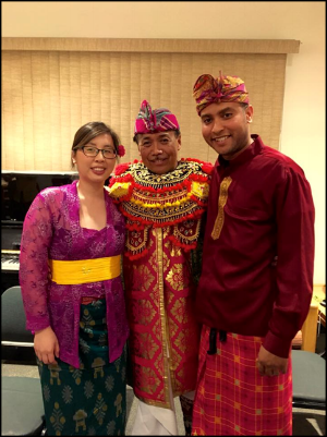 Derrick Spiva Jr. (right) and his wife Kim Tran (left) with their Balinese gamelan gong kebyar teacher, I Nyoman Wenten (center), after a performance in 2016.
