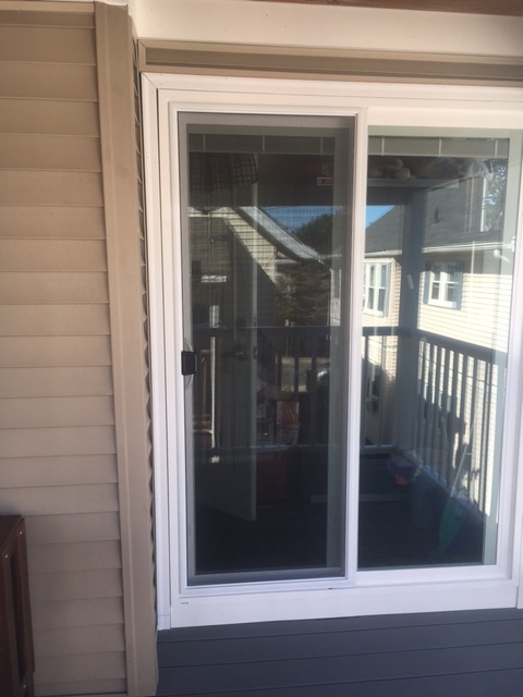 We removed the old single slab door and fit in a new sliding glass door.