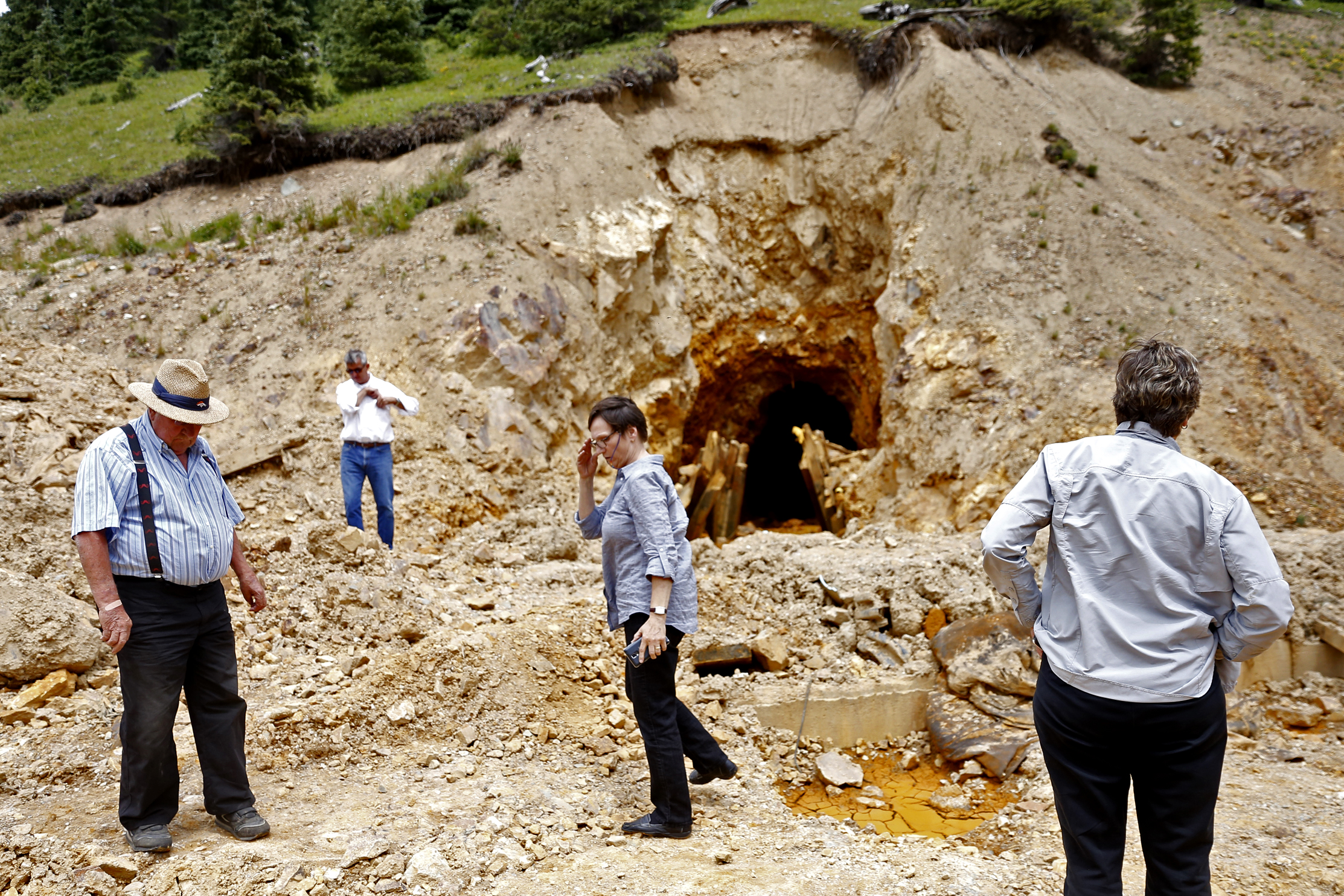 Environmental Protection Agency officials and San Juan, Colorado, County Commissioners tour the site where the Gold King Mine breached on Monday, Aug. 10, 2015, north of Silverton, Colorado. 