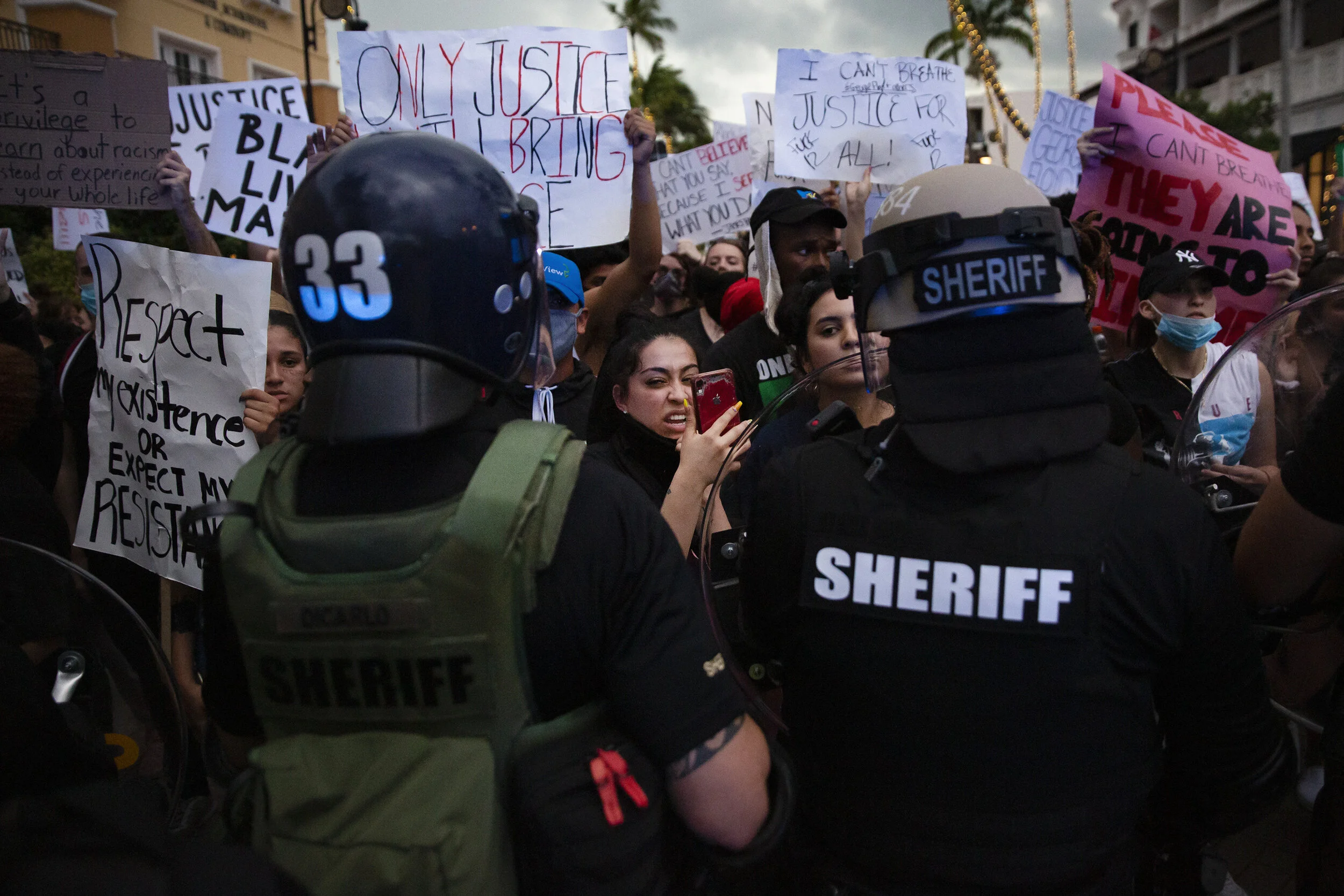  Protesters, angered by the killing of George Floyd, are held back by   Collier County Sheriff's Office deputies during a protest march through Fifth Avenue South in Naples on Monday, June 1, 2020. 