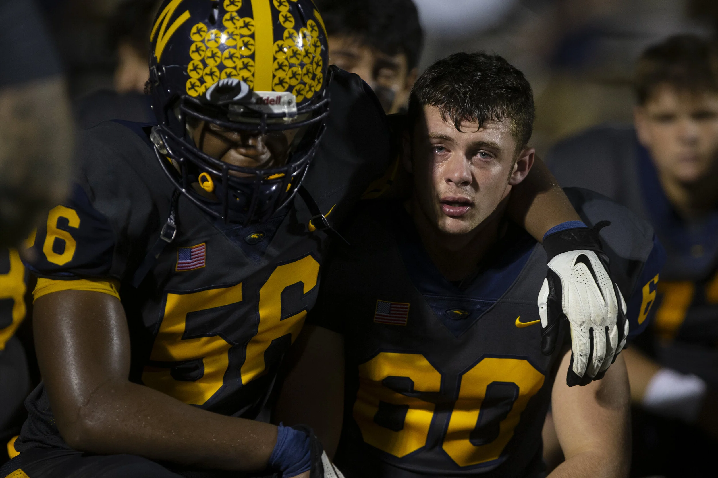  Naples High School's Amari Daniels , left, and outside linebacker Ryan Rodak (60) listen to their coach after losing to Miami Central 31-21 in the Class 6A-Region 4 semifinal game, Friday, Nov. 27, 2020, at Straver Field in Naples. 