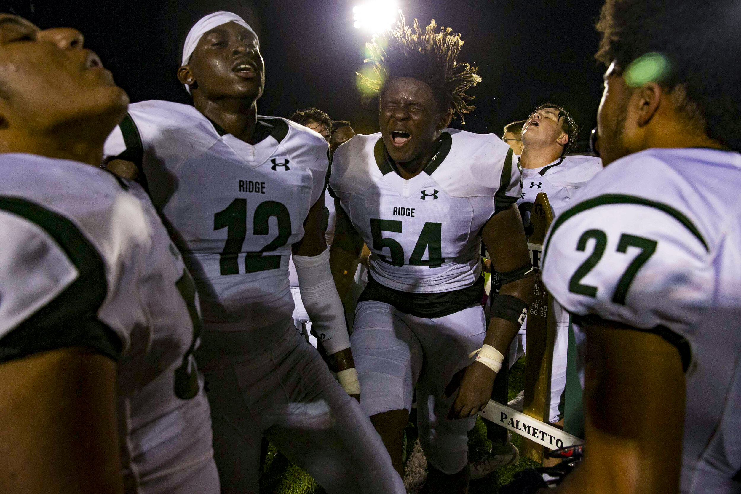 Palmetto Ridge High School football team celebrates their 26-18 win over Golden Gate High School, during the 15th annual Battle of the Gate rivalry game, Friday, Oct. 25, 2019, at Golden Gate High School.