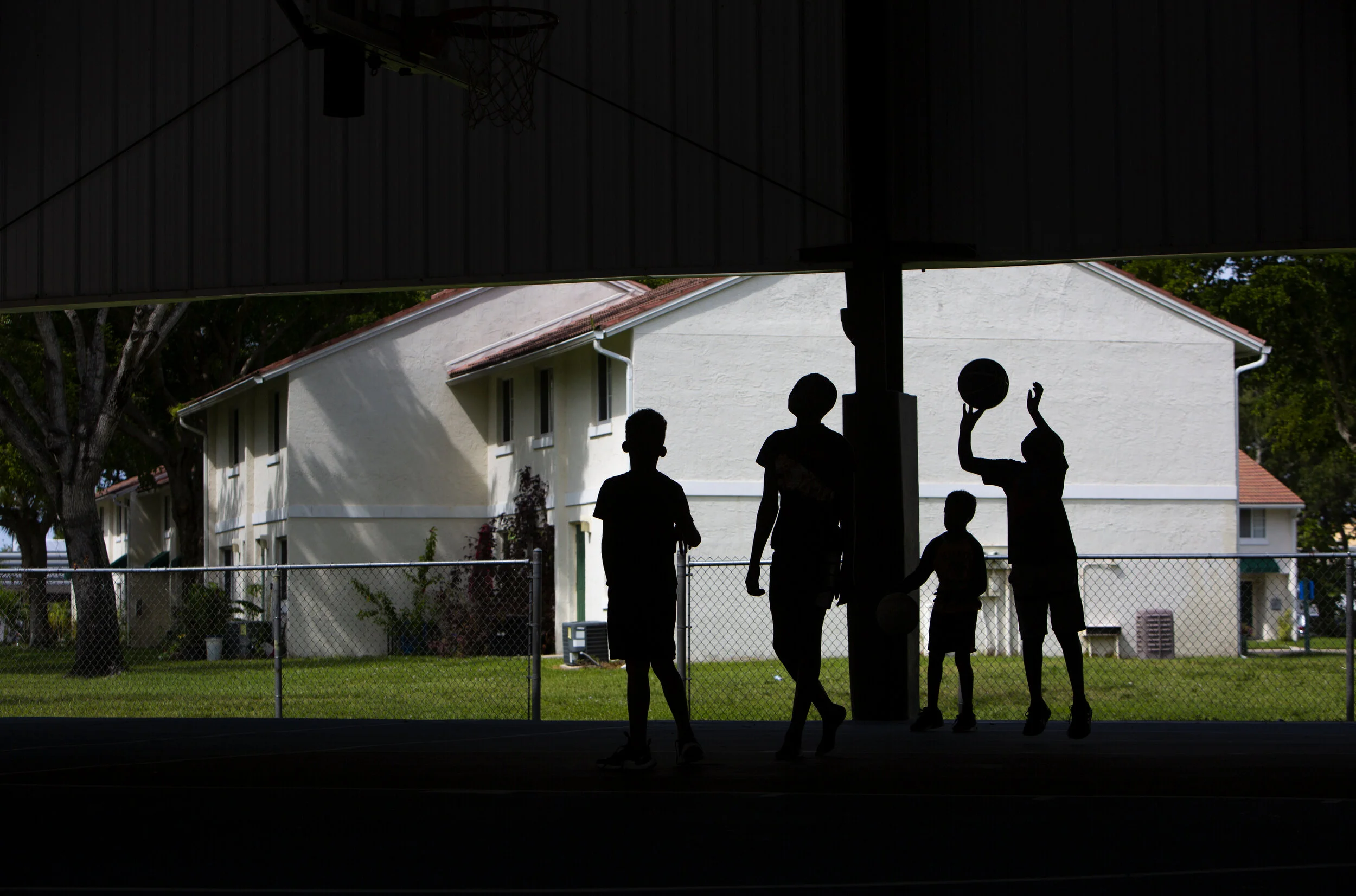  Children from the George Washington Carver Apartments play basketball, Oct. 9, 2109, at the River Park Community Center basketball court in River Park, Florida. 