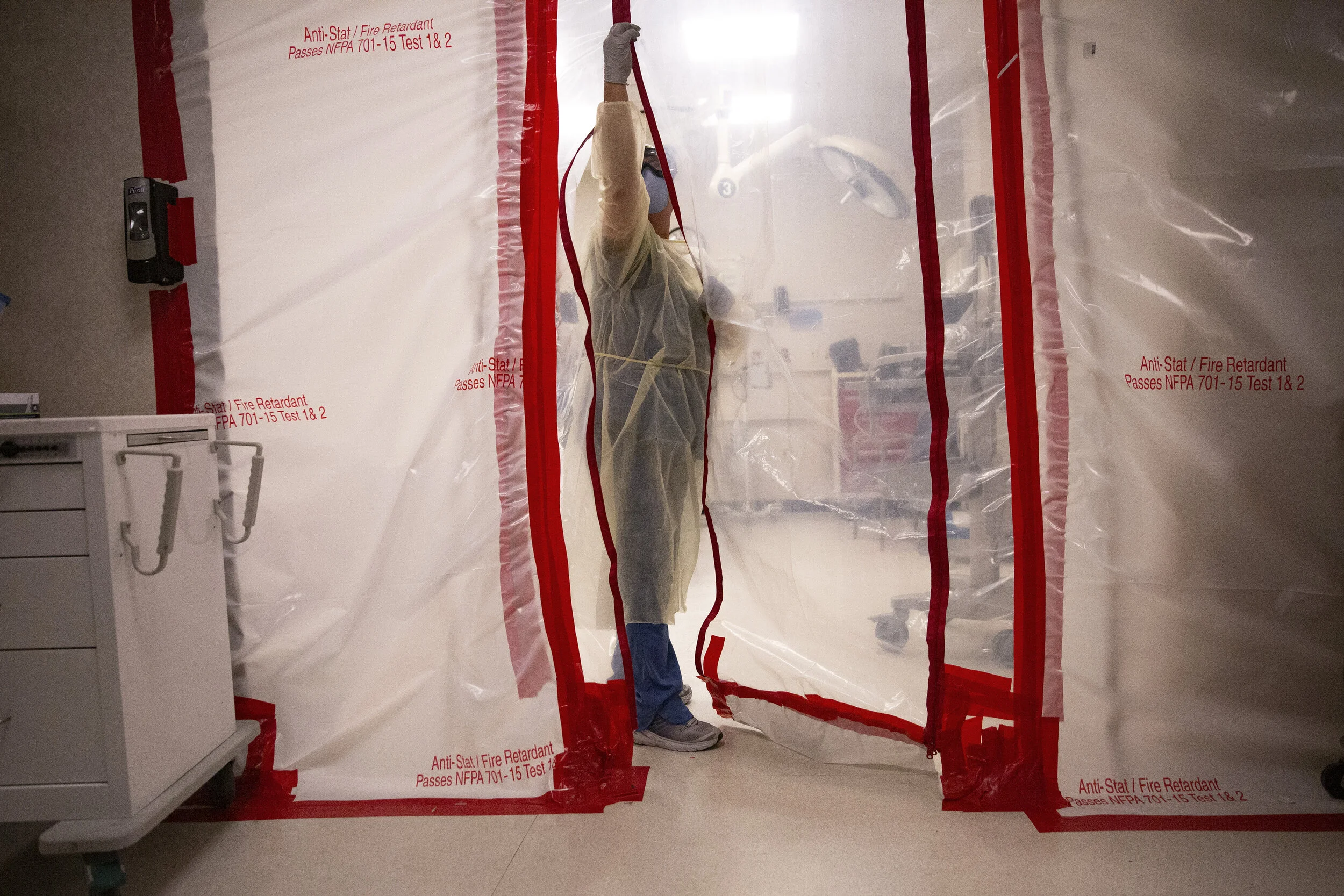  NCH Healthcare System RN Beth Davis enters a negative air-pressure room to work on a patient, Friday, April 17, 2020, at NCH Baker Hospital's emergency room in Naples. 