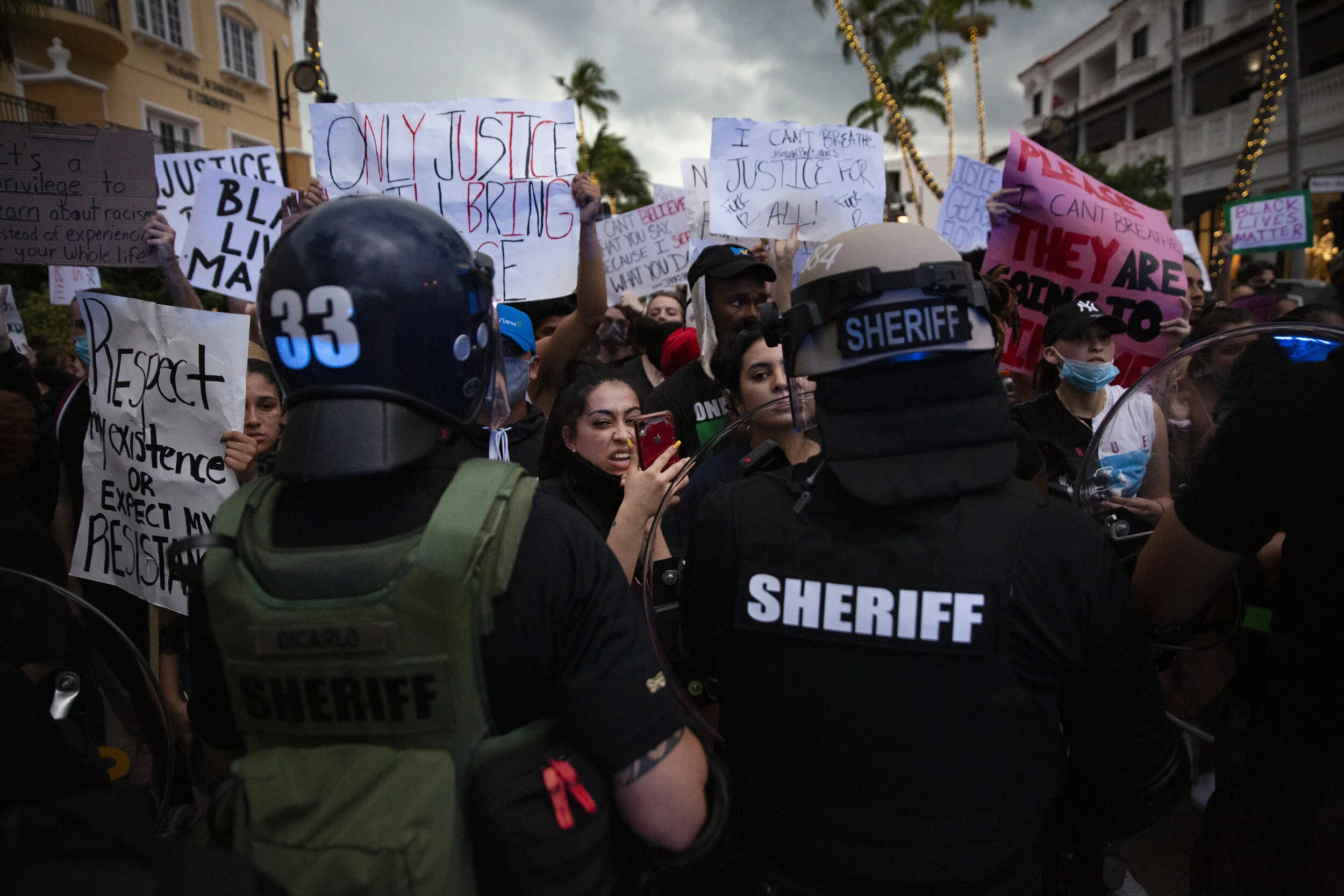  Protesters are held back by deputies from the Collier County Sheriff's Office, Monday, June 1, 2020. on Fifth Avenue South in Naples. Hundreds of protestors marched from the Collier County Courthouse to Fifth Avenue South to protest the killing of G