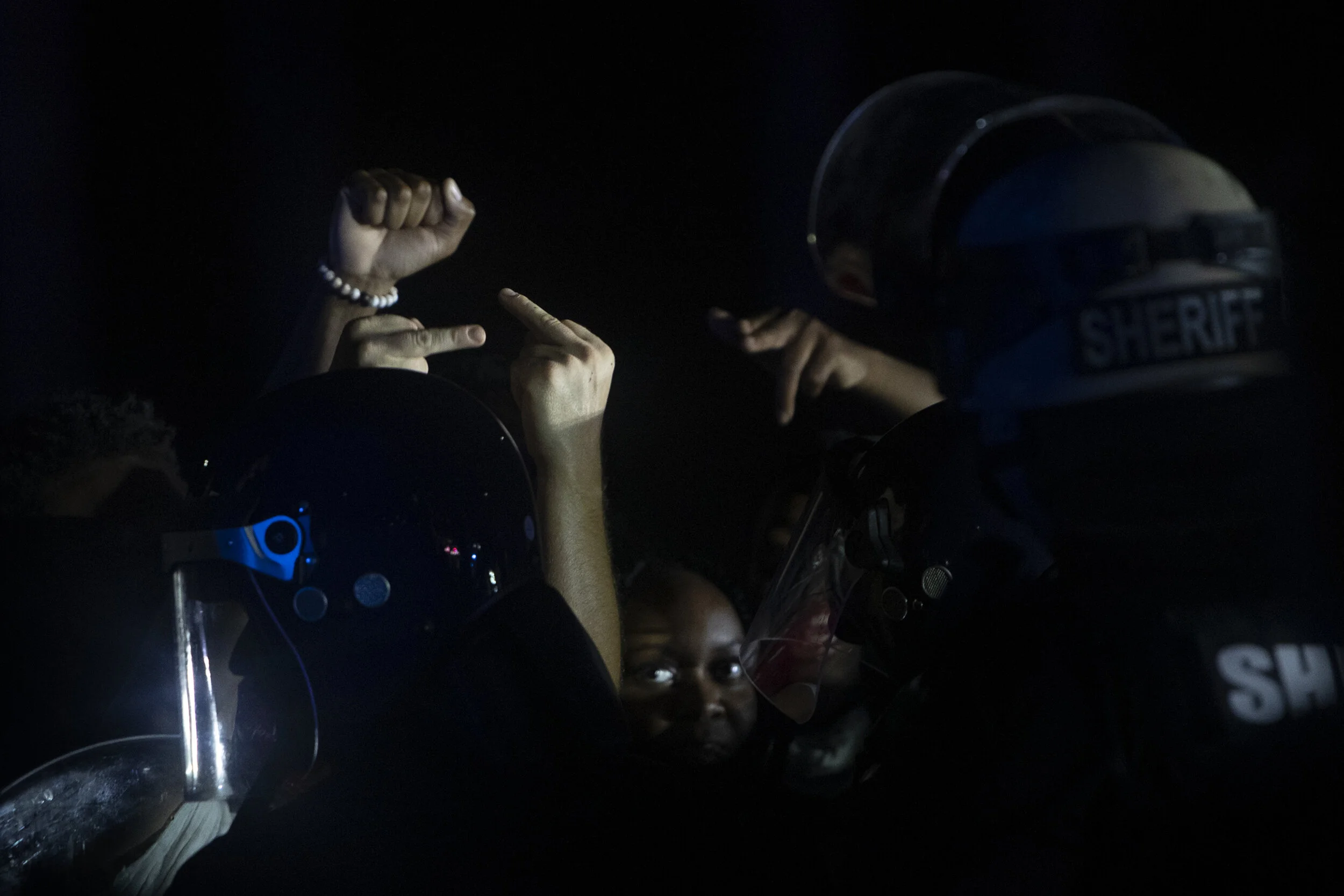  Protestors face off against local law enforcement officers during a demonstration against police brutality, Monday, June 1, 2020 in Naples. 