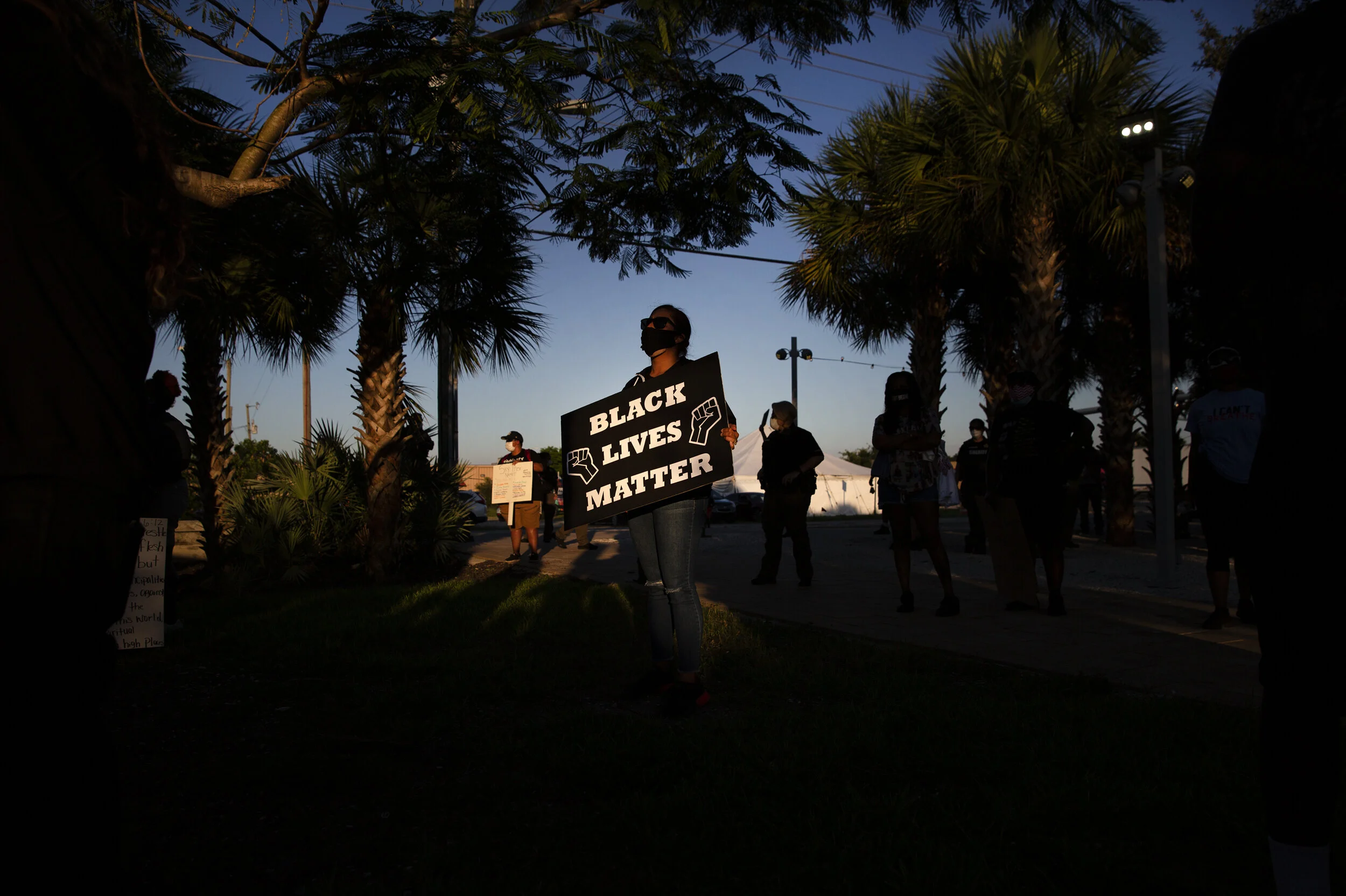  Yesenia Romero of Immokalee listens to speeches during a Black Lives Matter- Immokalee rally against police brutality and racial justice, Tuesday, June 16, 2020, at Zocalo Neighborhood Park in Immokalee.  