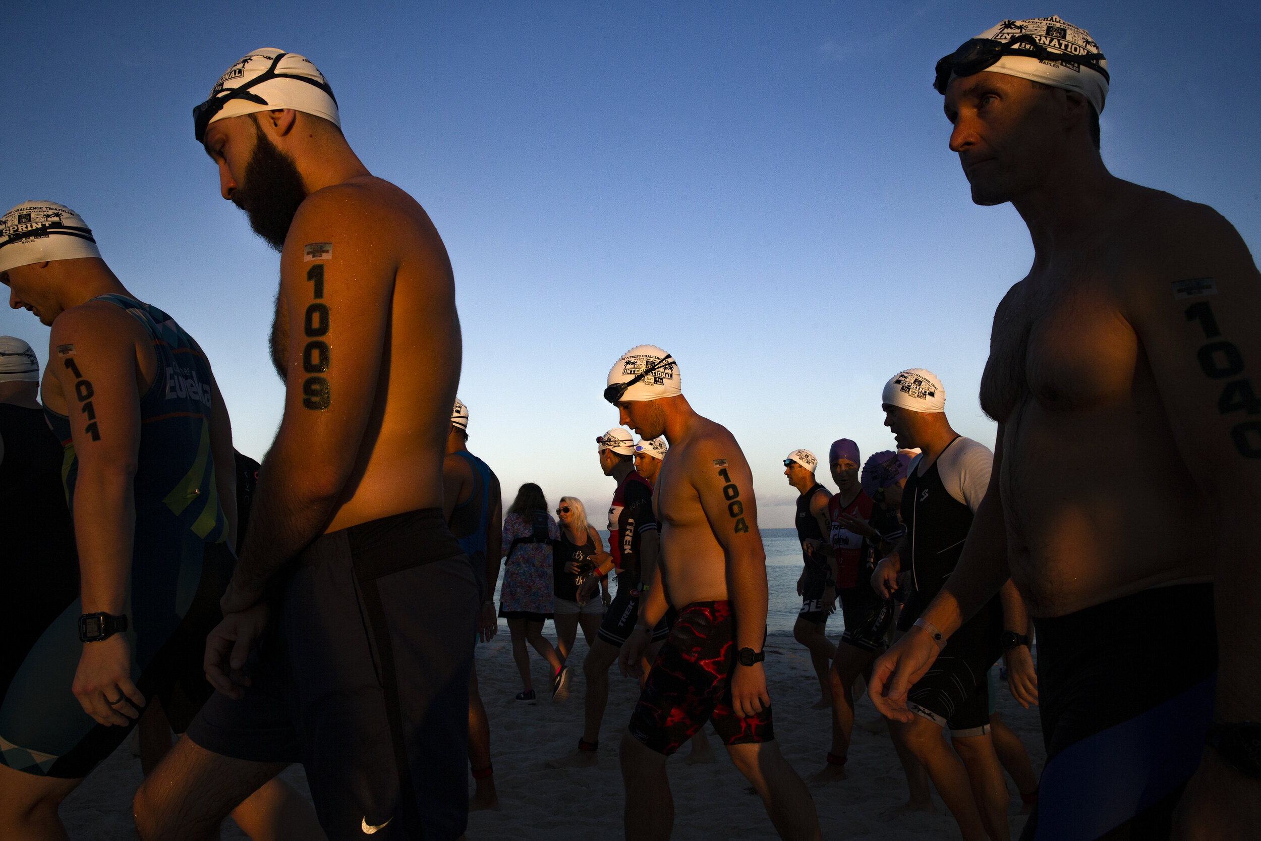 Triathletes head to the starting line during the Fitness Challenge Triathlon at the Naples Beach Hotel and Golf Club in Naples, Florida on Sunday, June 2, 2019.