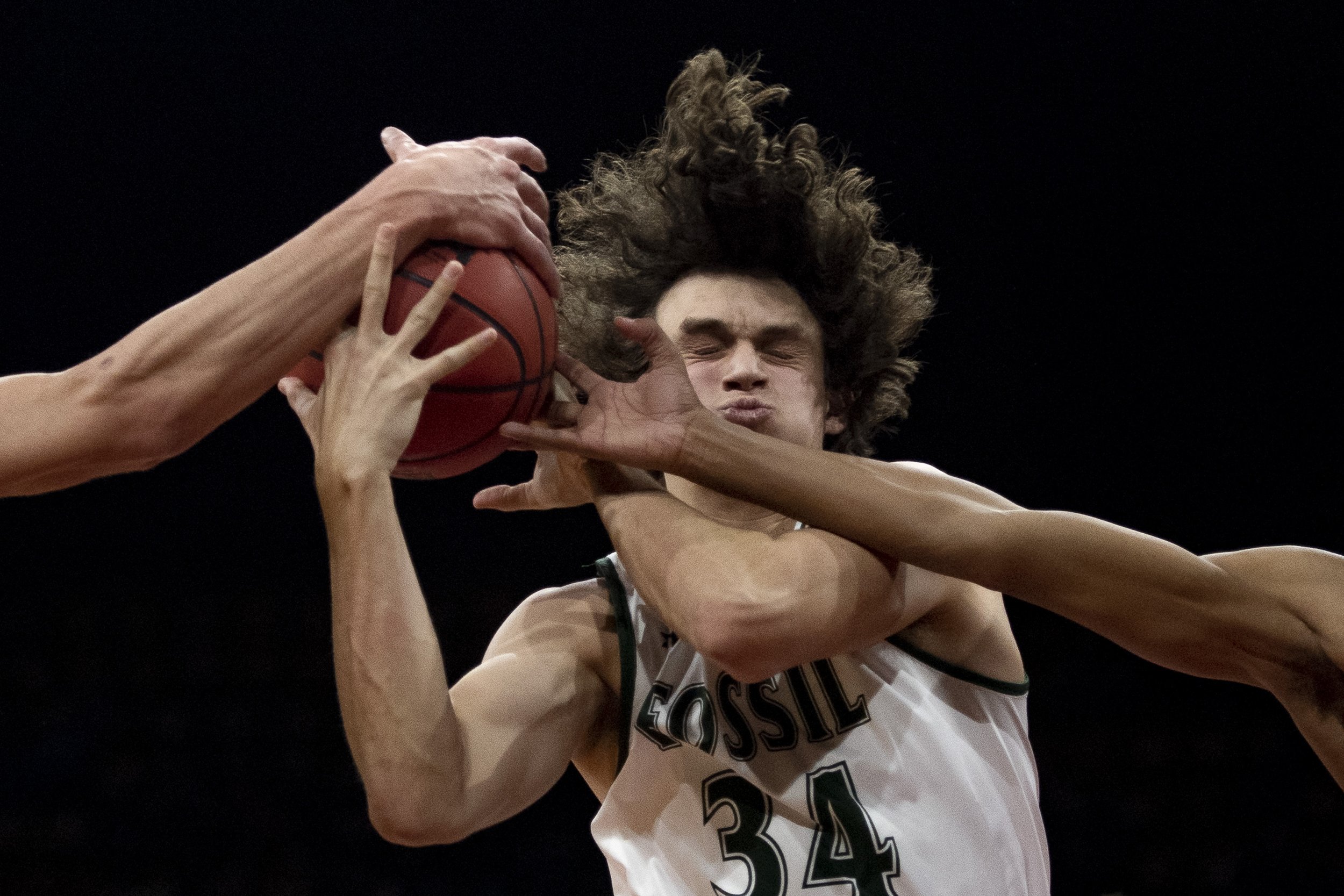 Fossil Ridge's Mac Busteed fights for the rebound against Chaparral during the CHSAA Class 5A Final Four game at the Denver Coliseum on Friday, March 11, 2022.