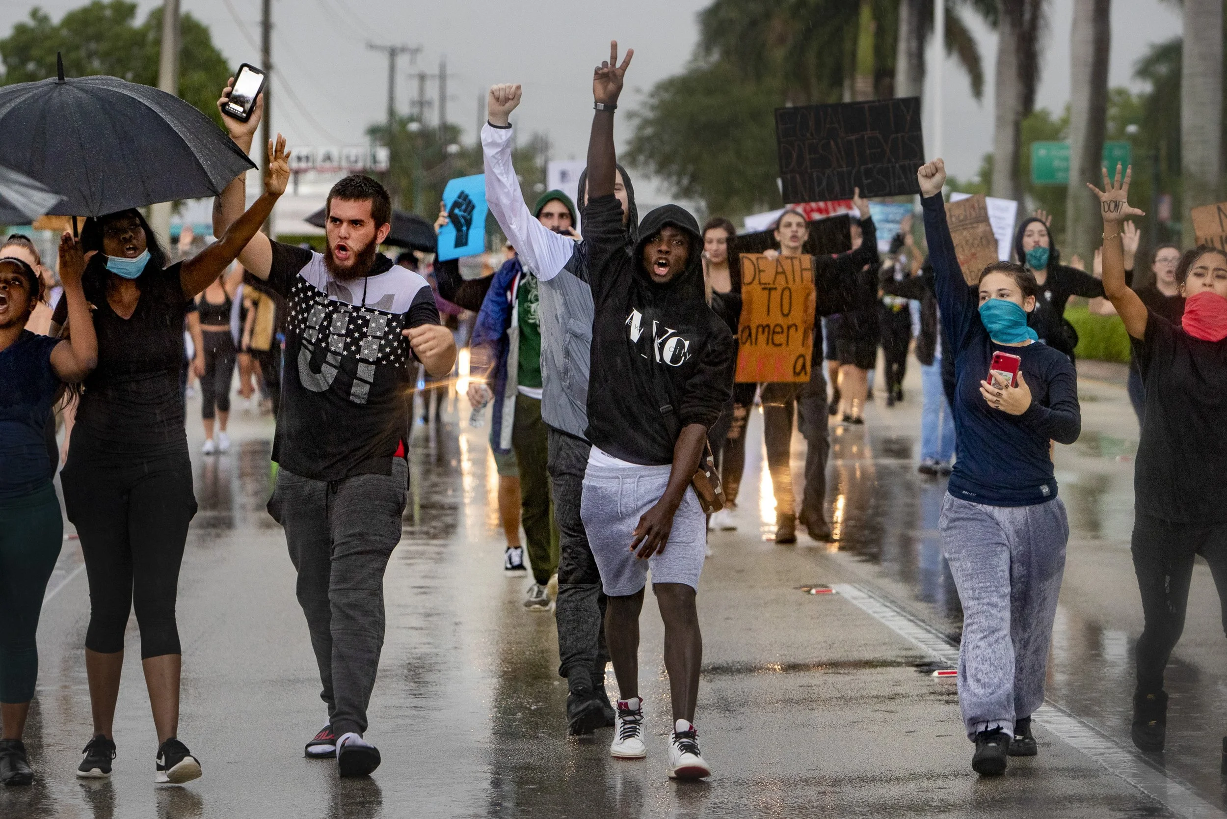 Community members make their way down U.S. 41 as they attempt a march to Fifth Avenue South in Naples on Tuesday, June 2, 2020, in Naples. Protesters were denied entry in to Naples and stopped at the foot of the Garden River bridge by the Collier Co