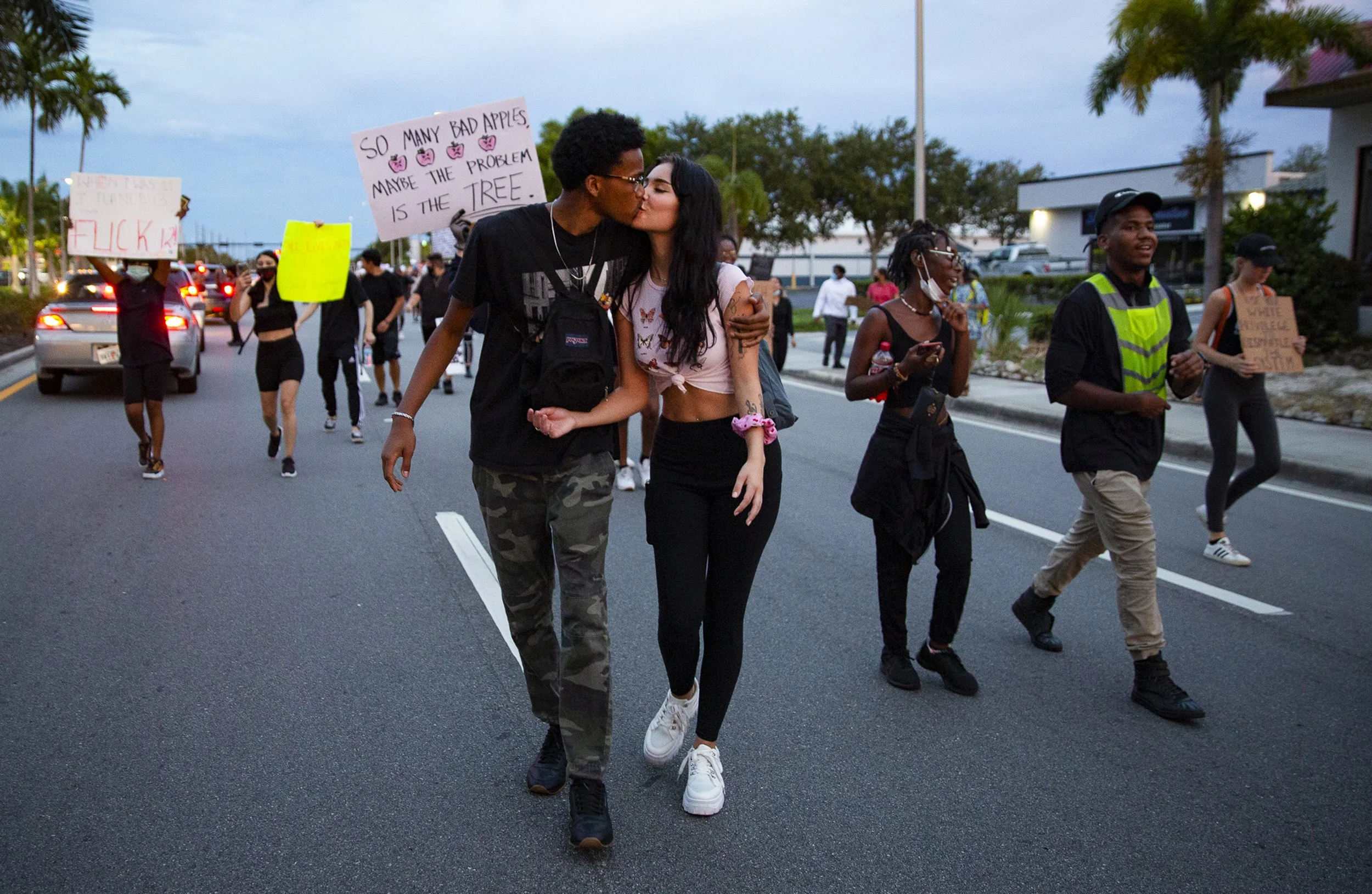 Protesters march west on Davis Boulevard following the 'We Can't Breathe' rally, Wednesday, June 10, 2020, in Naples.