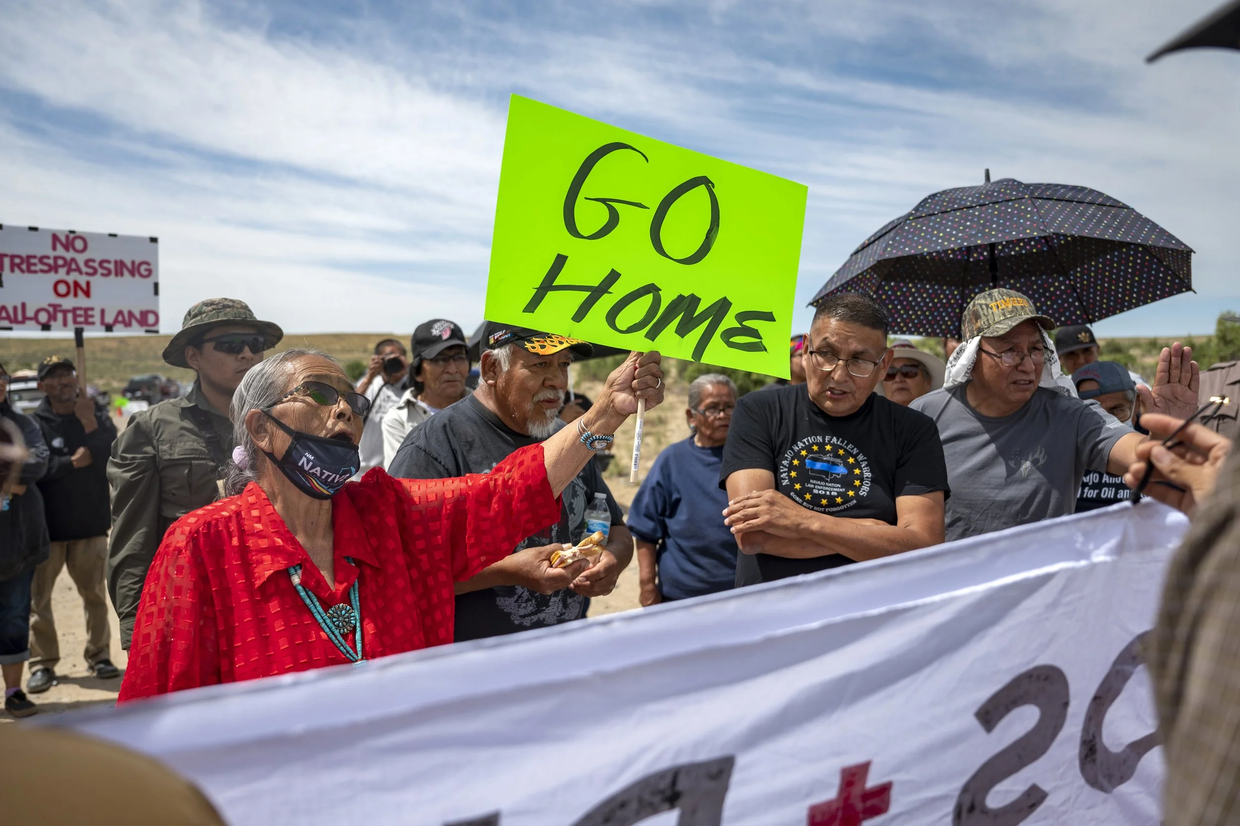  Landowner Paulina Atenico, at left, tell activist to “go home” near a road block on County Road 7950 east of Chaco Culture National Park on Sunday, June 11, 2023. Opponents and supporters for a buffer zone around Chaco Culture National Park clashed 