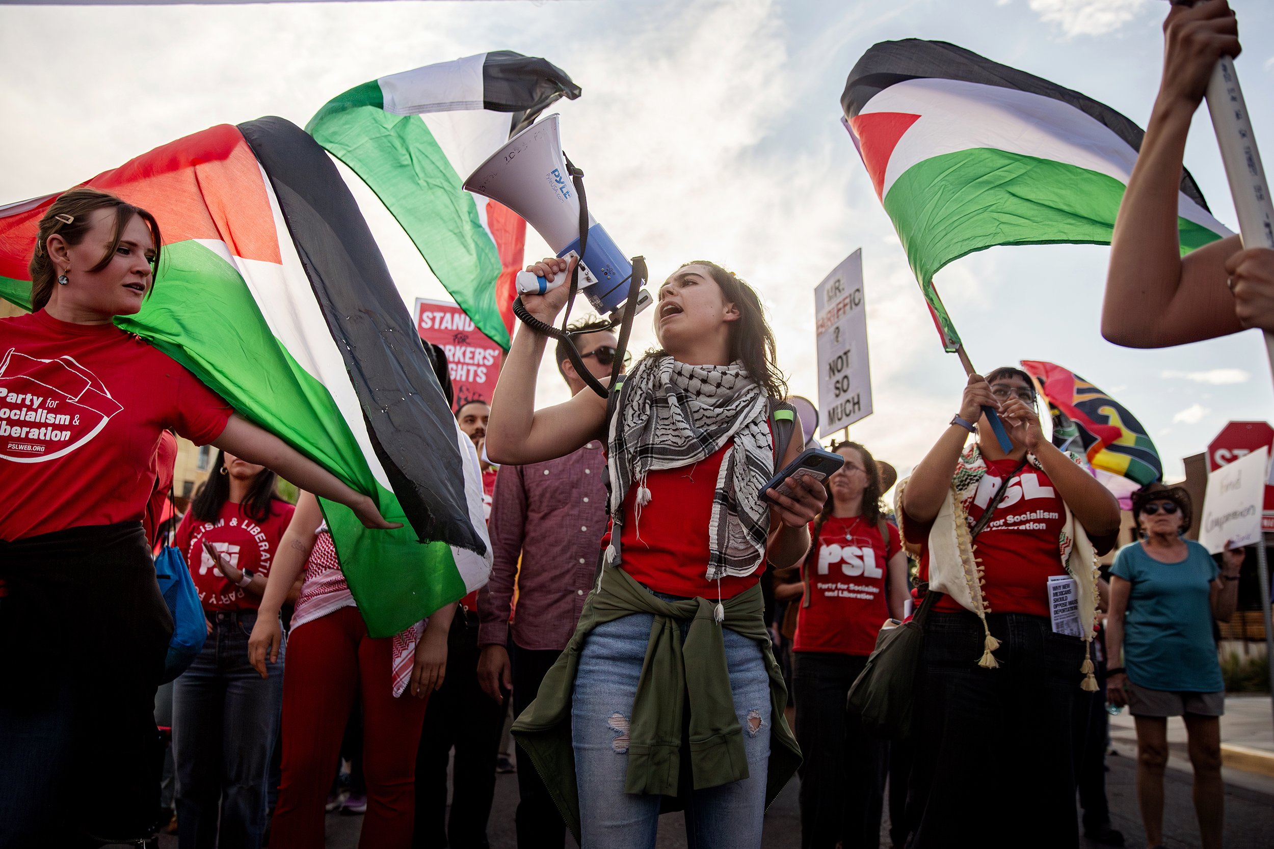 Pro-Palestine activist march down Rio Grande Boulevard during the annual May Day march in Old Town Albuquerque on May 1, 2025. Thousands rallied in support of various causes from workers and immigrant rights to veteran and LGBTQ causes during this y