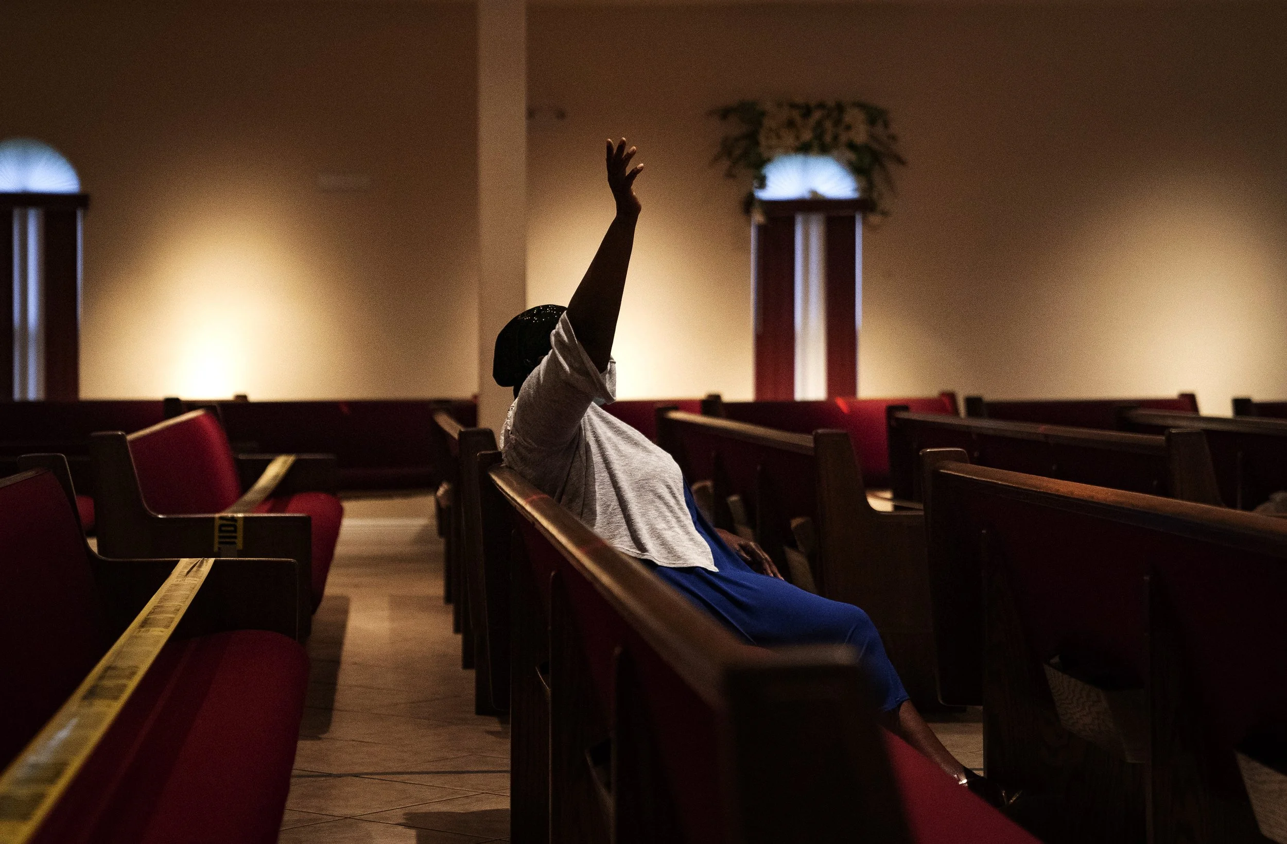  A member of The Independent Haitian Church of God, participates in an evening service in East Naples, Florida, on Tuesday, June 29, 2021. 