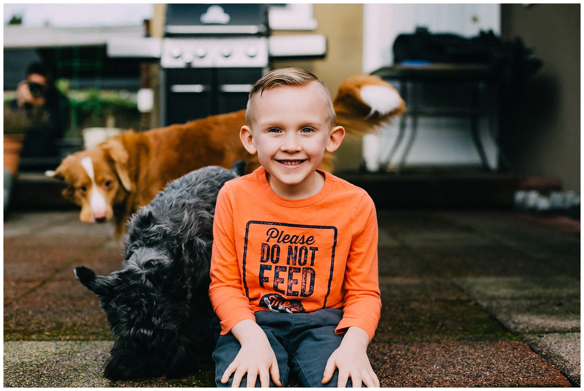 6 p.m.: Callum, with Gus and Bogey, and his dad photographing us in the background, Downtown Chilliwack.