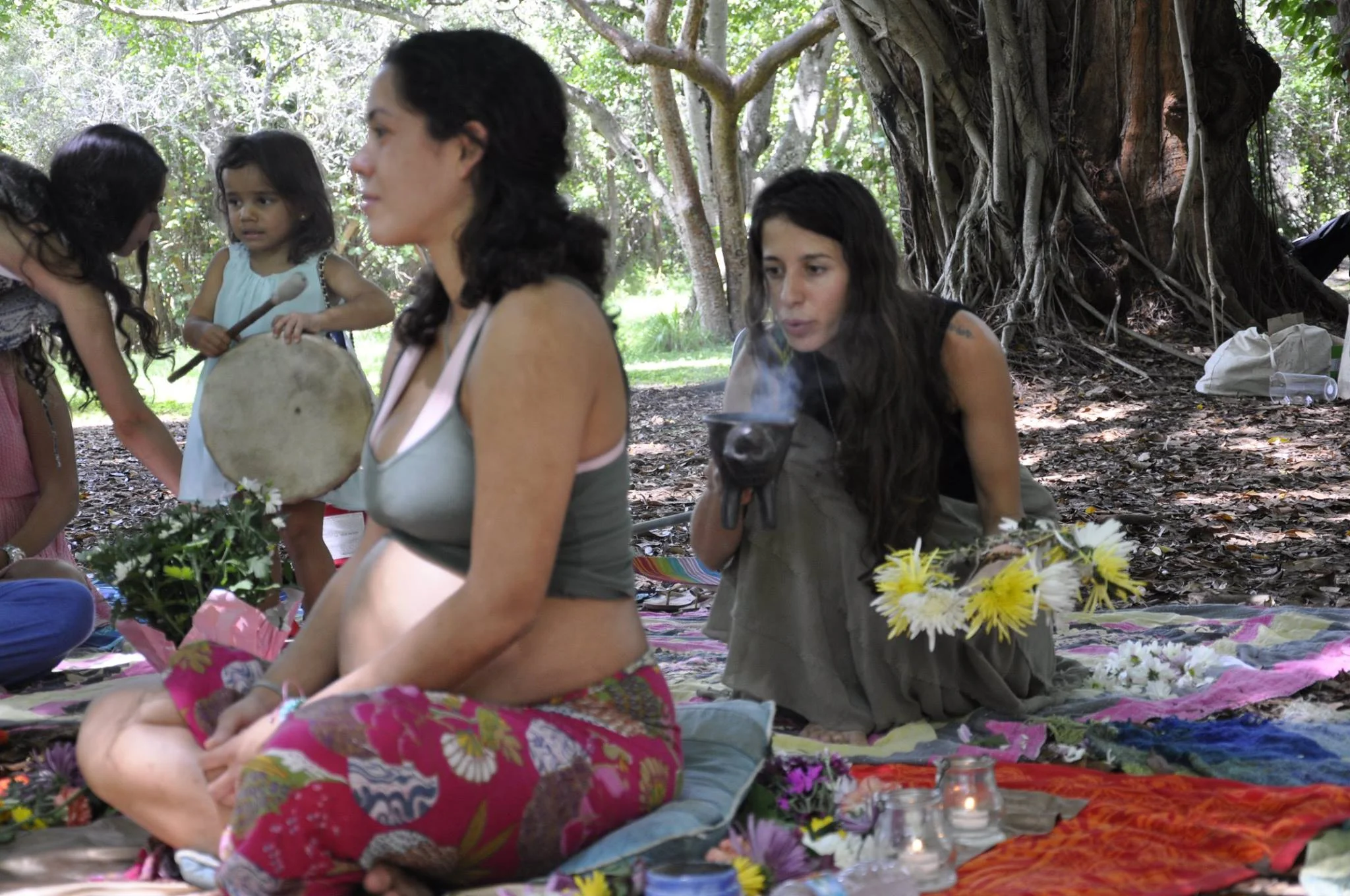 Cleansing a mama with copal during her blessing way ceremony 