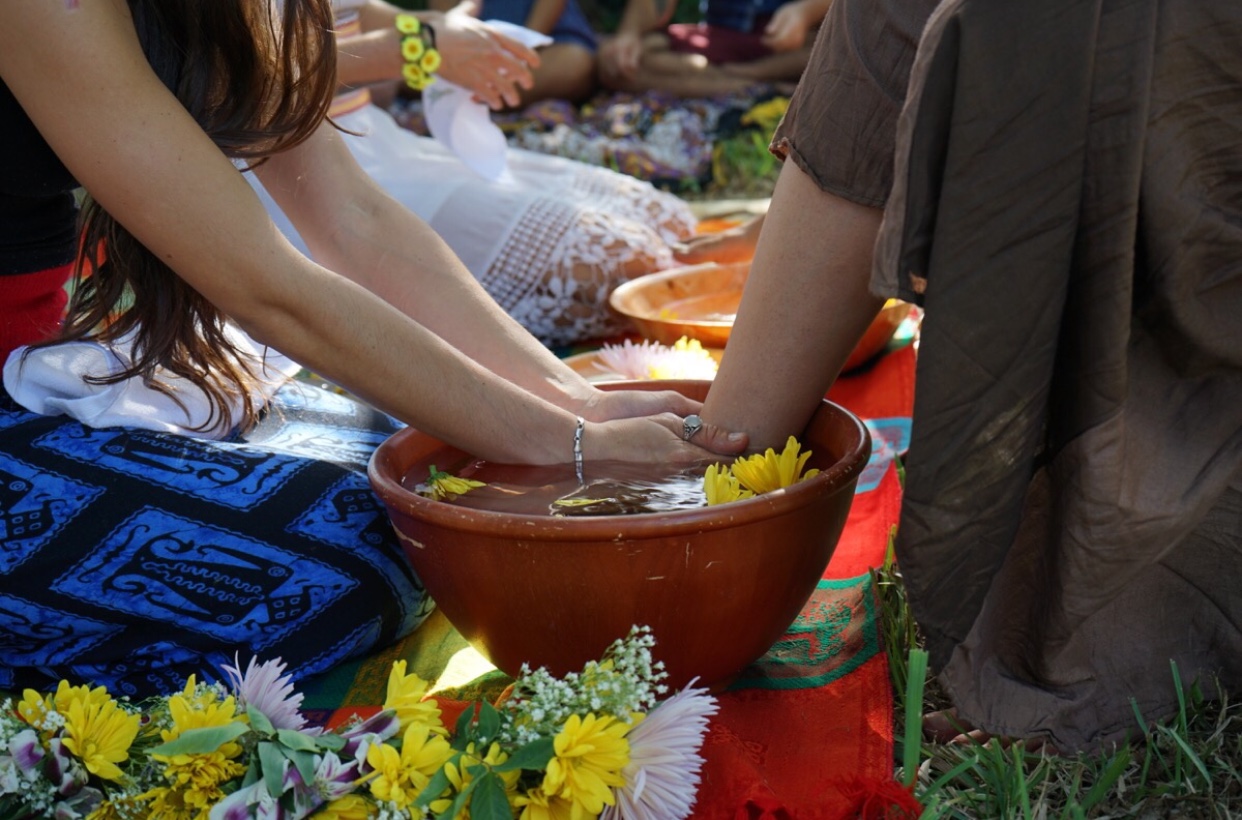 Victoria washing a mothers feet during her mother blessing ceremony
