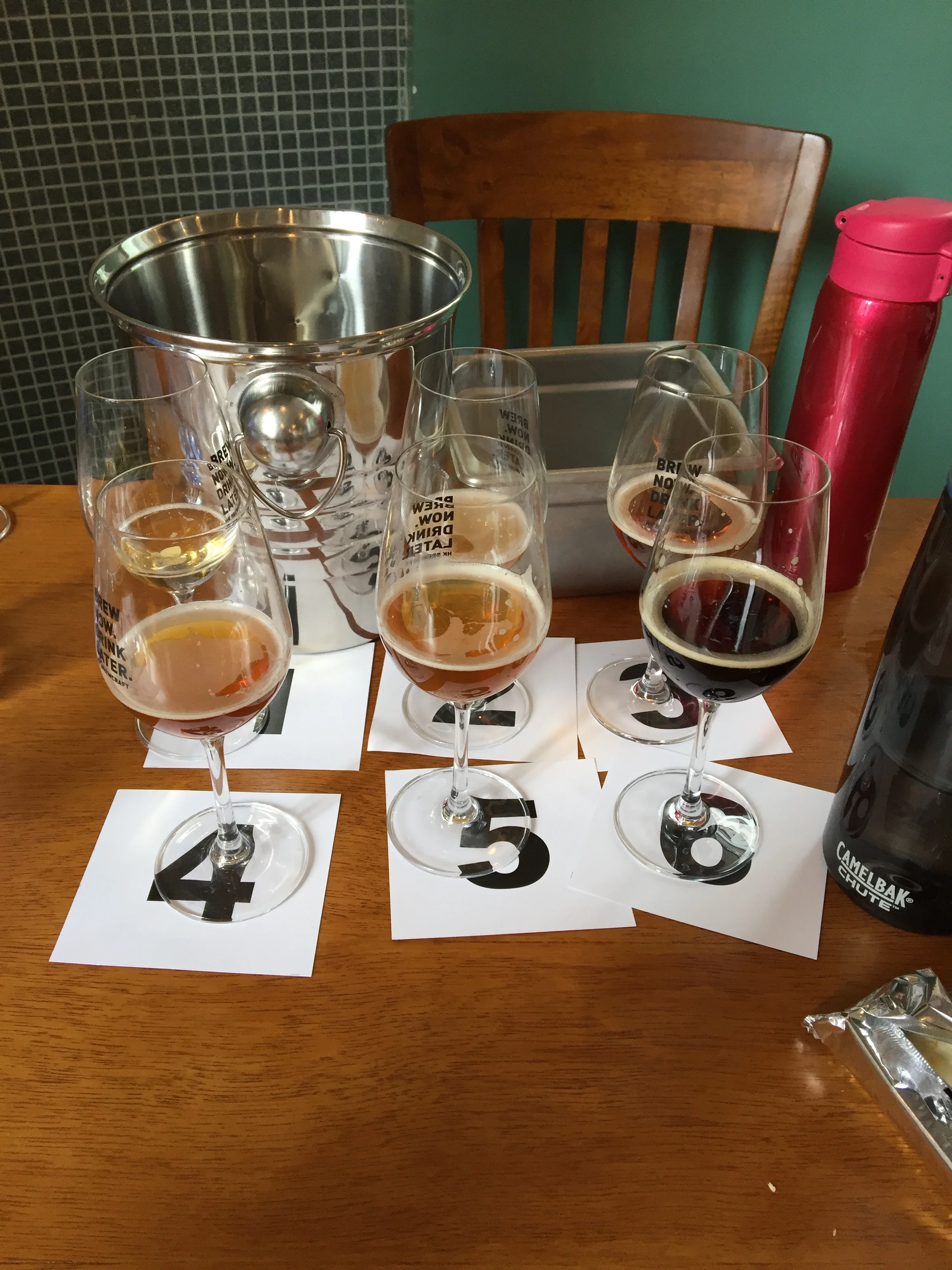 The aftermath....they bring out one sample at a time but you are allowed to go back and finish writing about previous samples at any point.  Our line-up included:  American Lager, English Bitter, German Hefeweizen, American IPA, Belgian Tr…